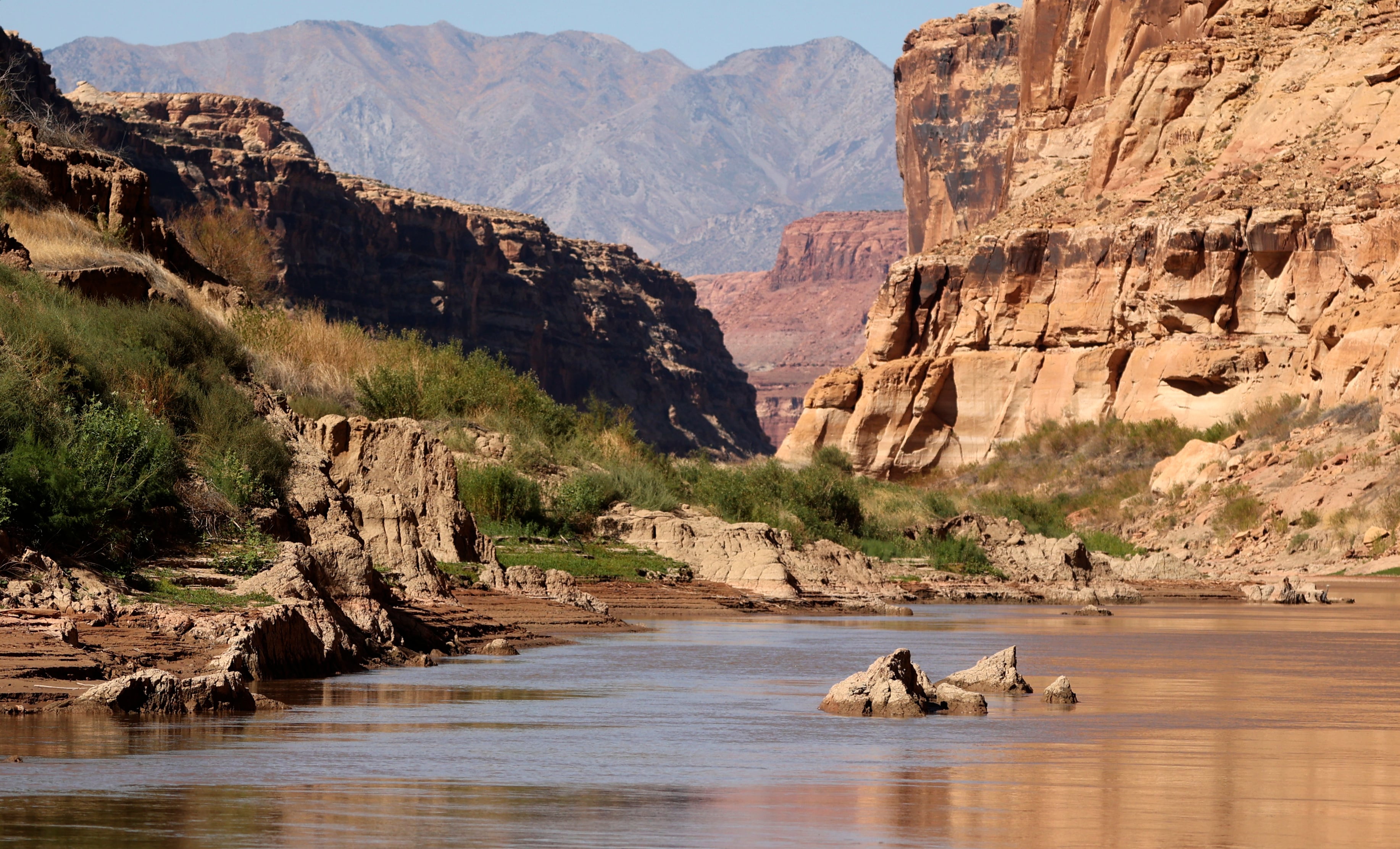 Mud deposits, referred to as mudbergs by Returning Rapids researchers, are pictured in the Colorado River and lining the river banks by Mille Crag Bend, between Cataract Canyon Glen Canyon Dam, on Sept. 22. The sediment filled in when this area was submerged under Lake Powell. After the lake receded, mud remains.