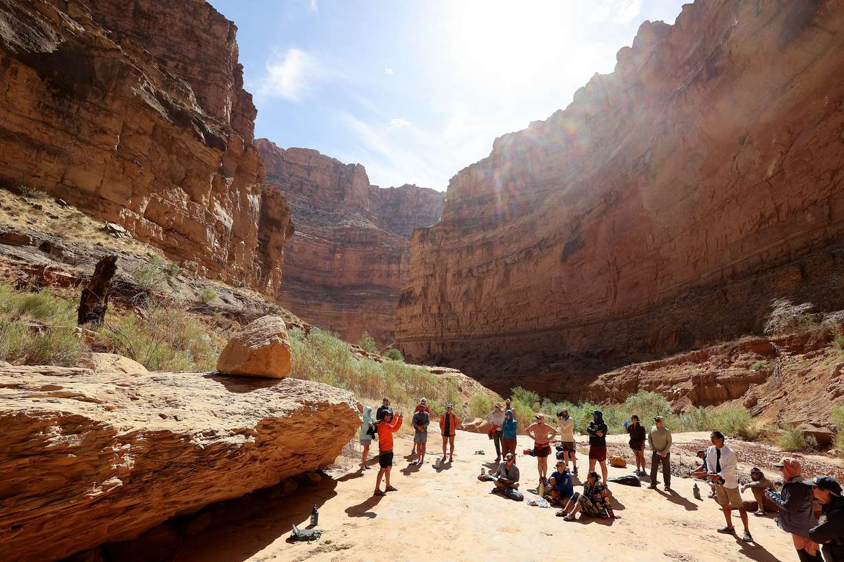 Eric Balken, Glen Canyon Institute executive director, gives a talk in Clearwater Canyon during a Returning Rapids trip through Cataract Canyon on the Colorado River on Saturday, Sept. 21. Where the group is standing would have been under 20-30 feet of water when Lake Powell was at its highest, estimates Mike DeHoff, Returning Rapids principal investigator.