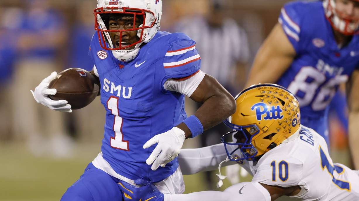 SMU running back Brashard Smith (1) is brought down by Pittsburgh defensive back Ryland Gandy (10) during the first half of an NCAA college football game in Dallas, Saturday, Nov. 2, 2024.