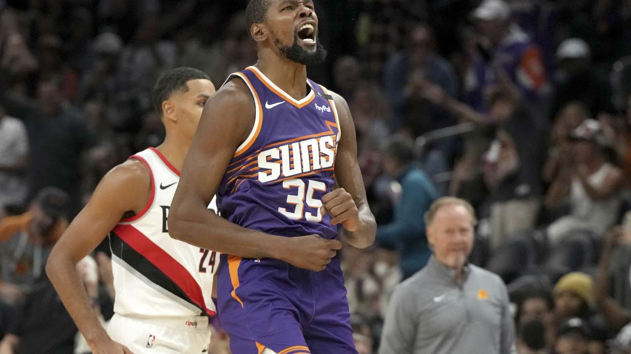 Phoenix Suns forward Kevin Durant (35) reacts after scoring against the Portland Trail Blazers during the first half of an NBA basketball game, Saturday, Nov. 2, 2024, in Phoenix.