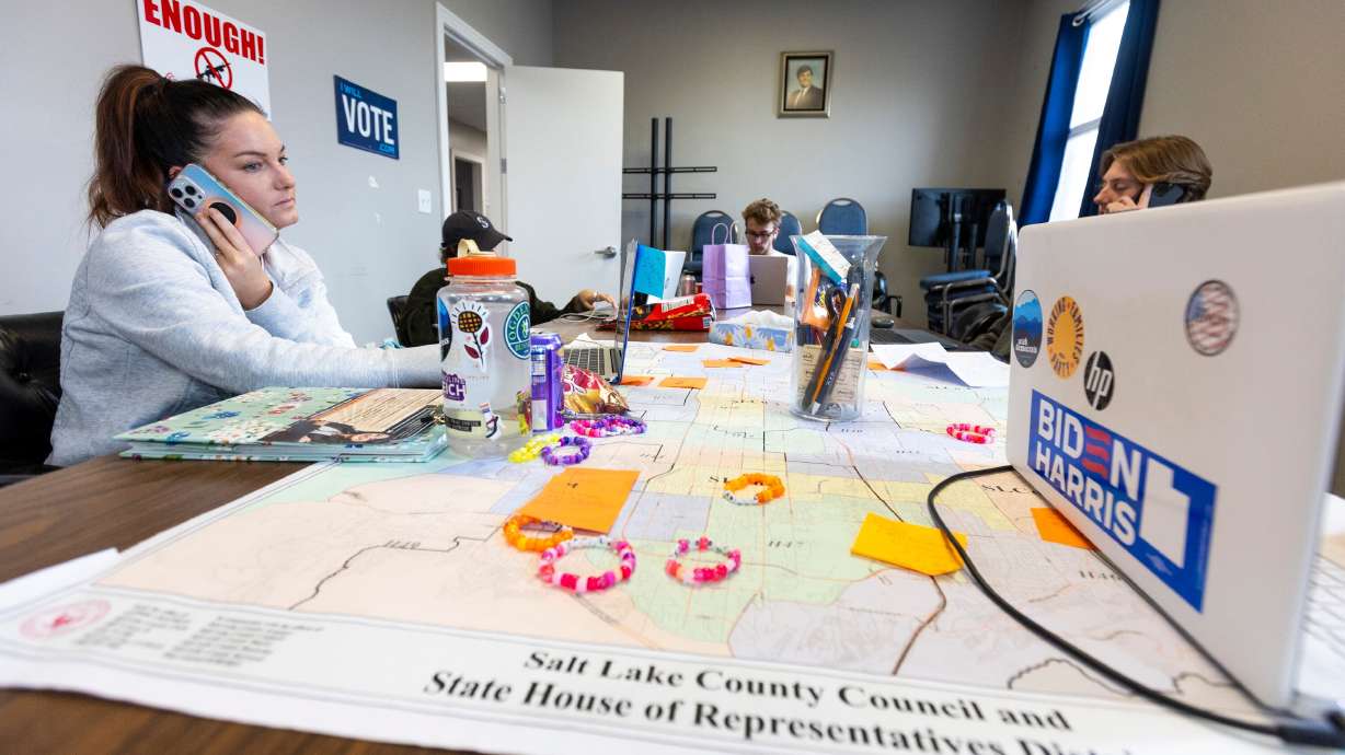 Danielle Sikes, left, a field organizer with the Utah Democratic Party, makes calls to voters with other field organizers during the lead up to the election at the Utah Democratic Party Head Quarters in Salt Lake City on Friday.