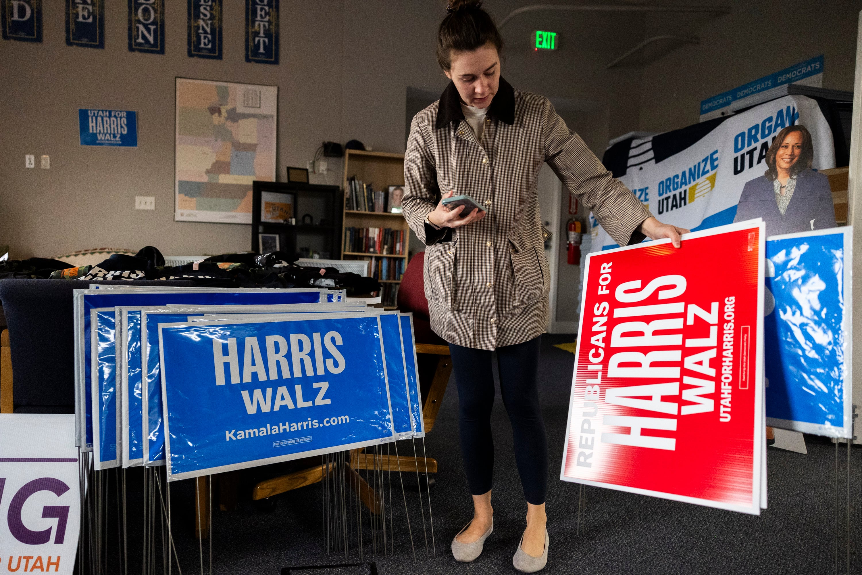 Bridget Baldwin, from Salt Lake City, looks at campaign signs while picking out signs for her parents at the Utah Democratic Party Head Quarters in Salt Lake City on Friday. Baldwin said that this is the second time she has had to pick up signs for her parents after their signs were stolen from their yard in Cedar Hills.