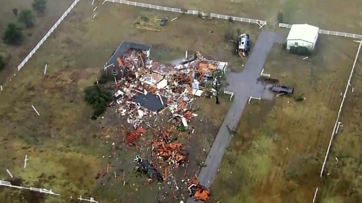 This image taken from video provided by KOCO shows damage caused by a tornado in a neighborhood near 89th and S. Sooner Road in North Moore, Okla., Sunday.