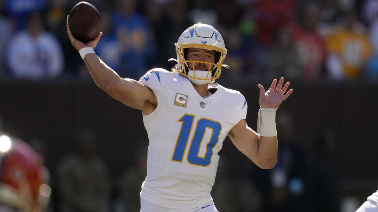 Los Angeles Chargers quarterback Justin Herbert passes against the Cleveland Browns in the first half of an NFL football game Sunday, Nov. 3, 2024, in Cleveland.