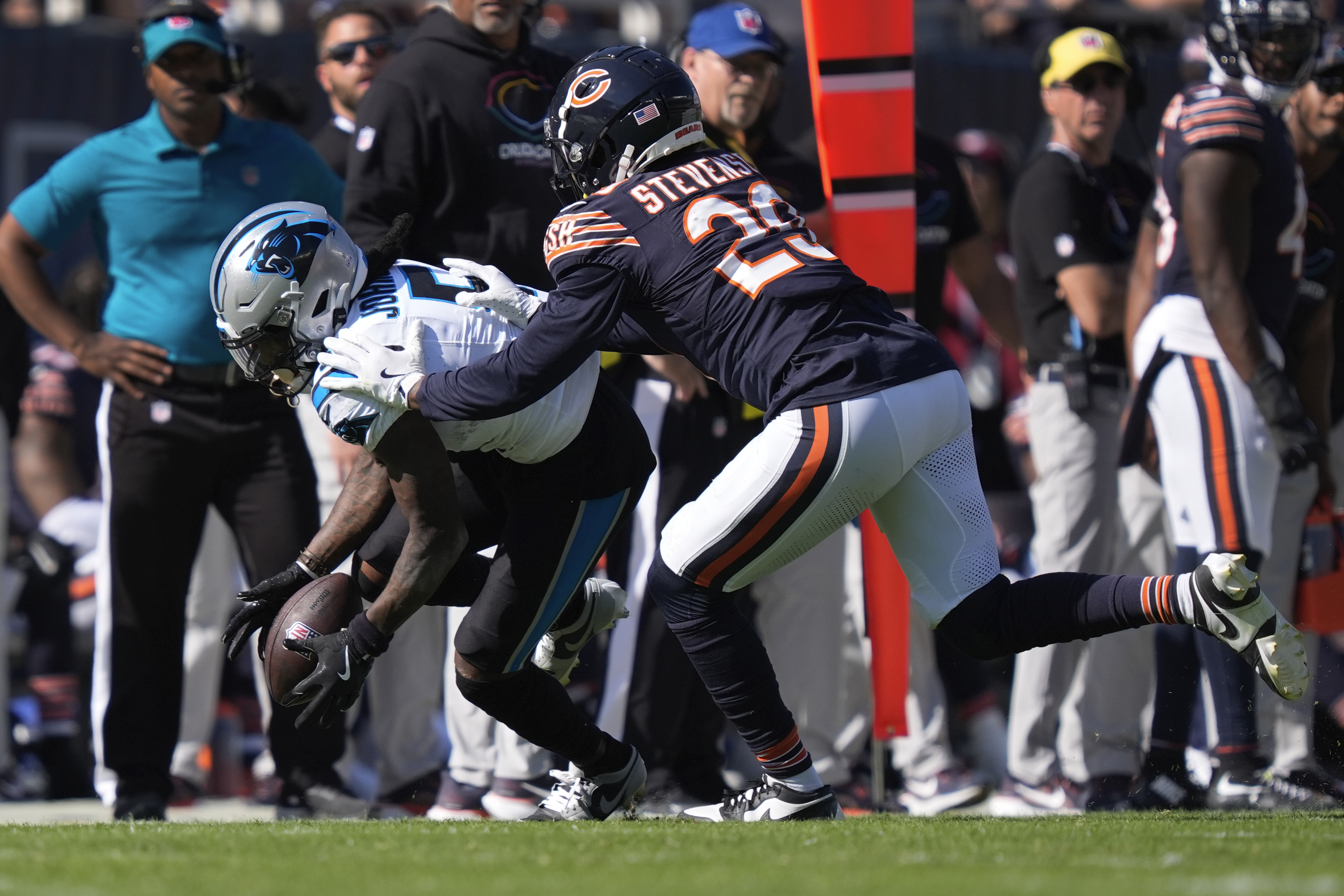 Carolina Panthers wide receiver Diontae Johnson (5) pulls in a reception as Chicago Bears cornerback Tyrique Stevenson (29) defends during the second half of an NFL football game Sunday, Oct. 6, 2024, in Chicago.