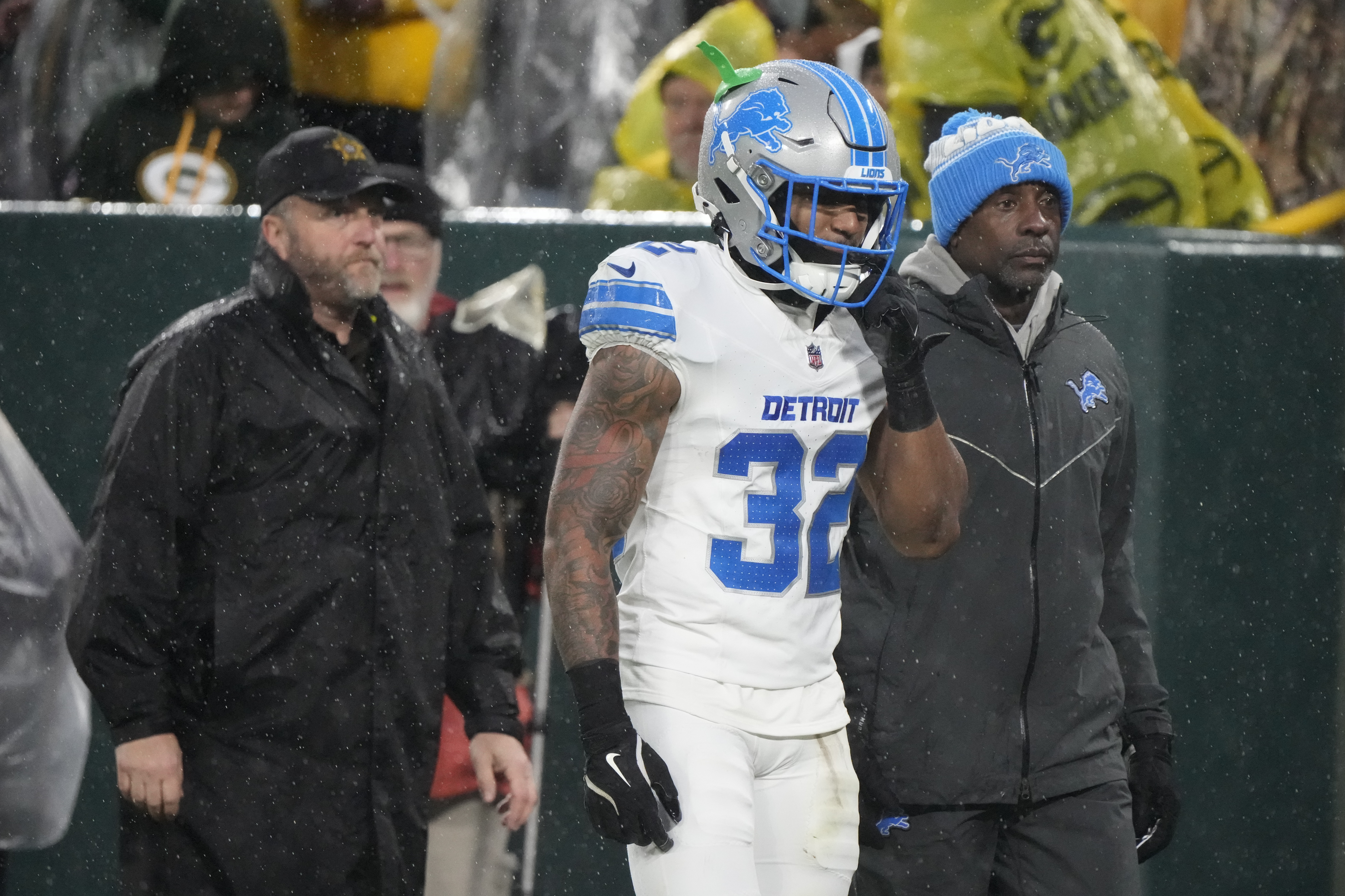 Detroit Lions safety Brian Branch (32) leaves the game after being disqualified during the first half of an NFL football game against the Green Bay Packers Sunday, Nov. 3, 2024, in Green Bay, Wis.