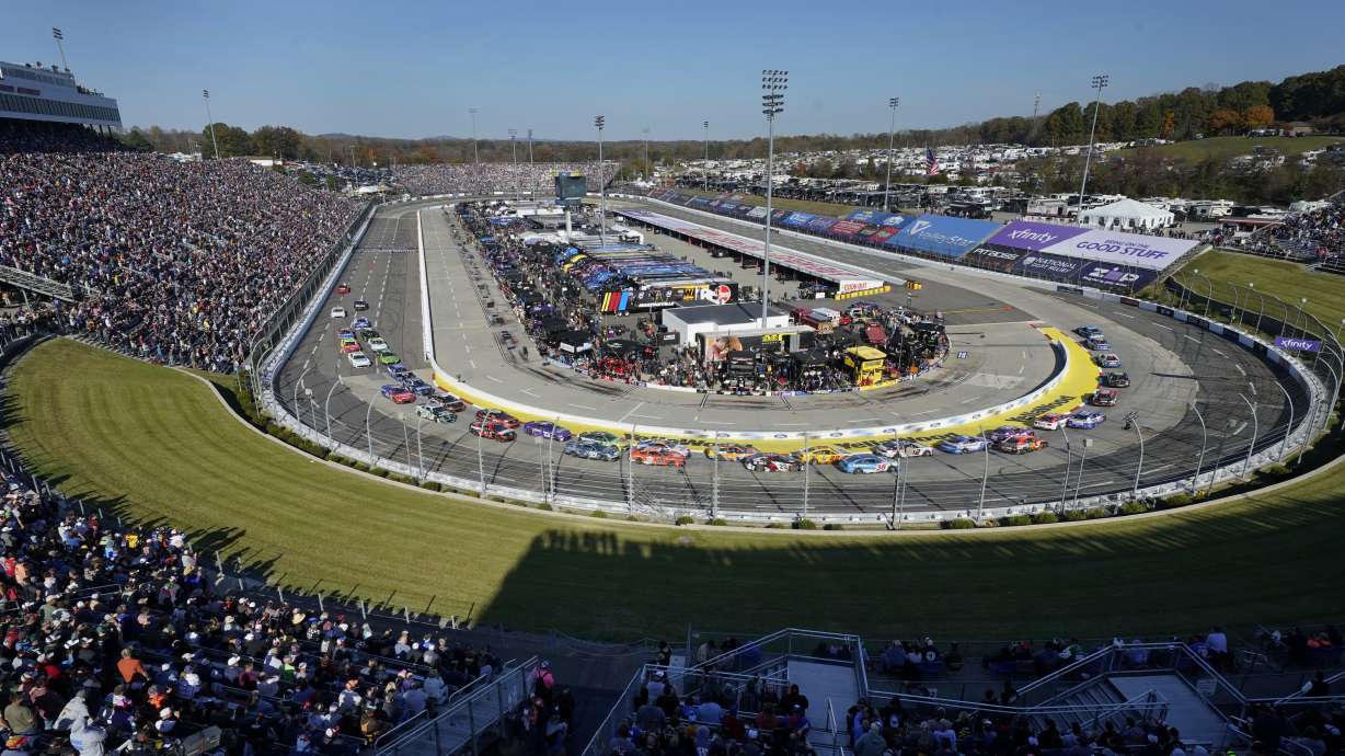 Drivers race their cars in Turns 1 and 2 during a NASCAR Cup Series auto race at Martinsville Speedway in Martinsville, Va., Sunday, Nov. 3, 2024.