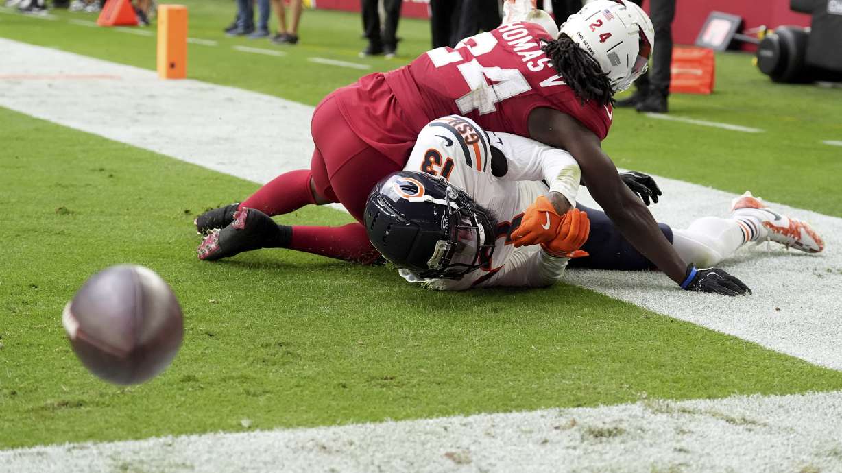 Arizona Cardinals cornerback Starling Thomas V (24) breaks up a pass in the end zone intended for Chicago Bears wide receiver Keenan Allen (13) during the first half of an NFL football game, Sunday, Nov. 3, 2024, in Glendale, Ariz.