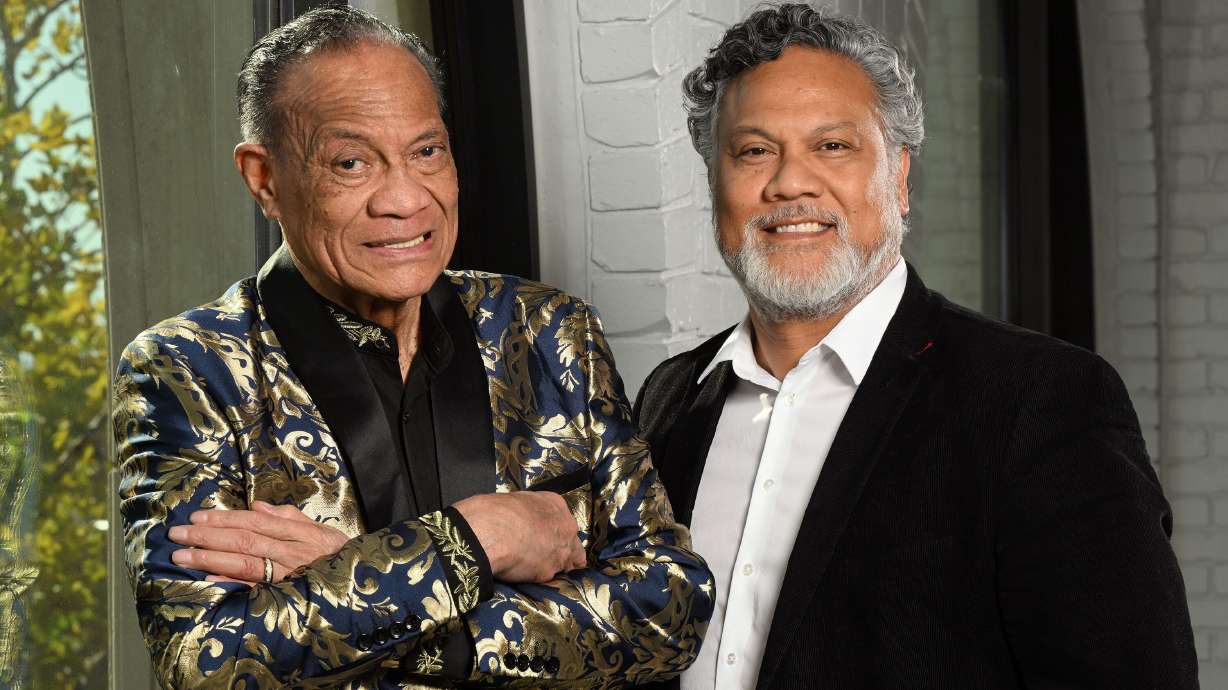 Eddie Taumoepeau and his son, Afu Taumoepeau, pose for photos at Afu’s office in Farmington on Oct. 11. Eddie Taumoepeau was a successful boxer in his youth. The son is involved in cutting-edge computer developments.