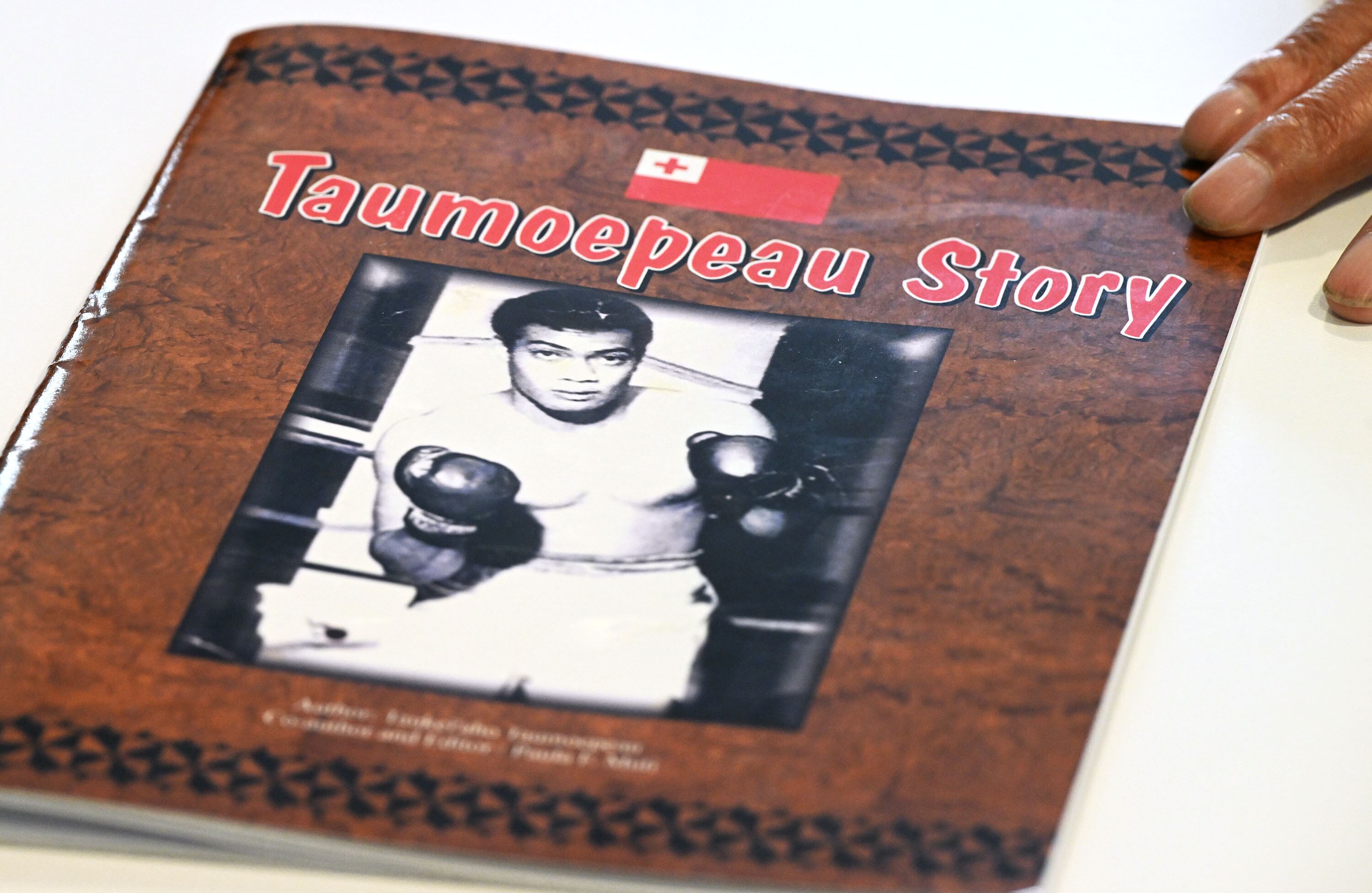 A small book that a family member had printed detailing Eddie Taumoepeau and his boxing life, in Farmington, on Oct. 11. Taumoepeau was a successful boxer in his youth.