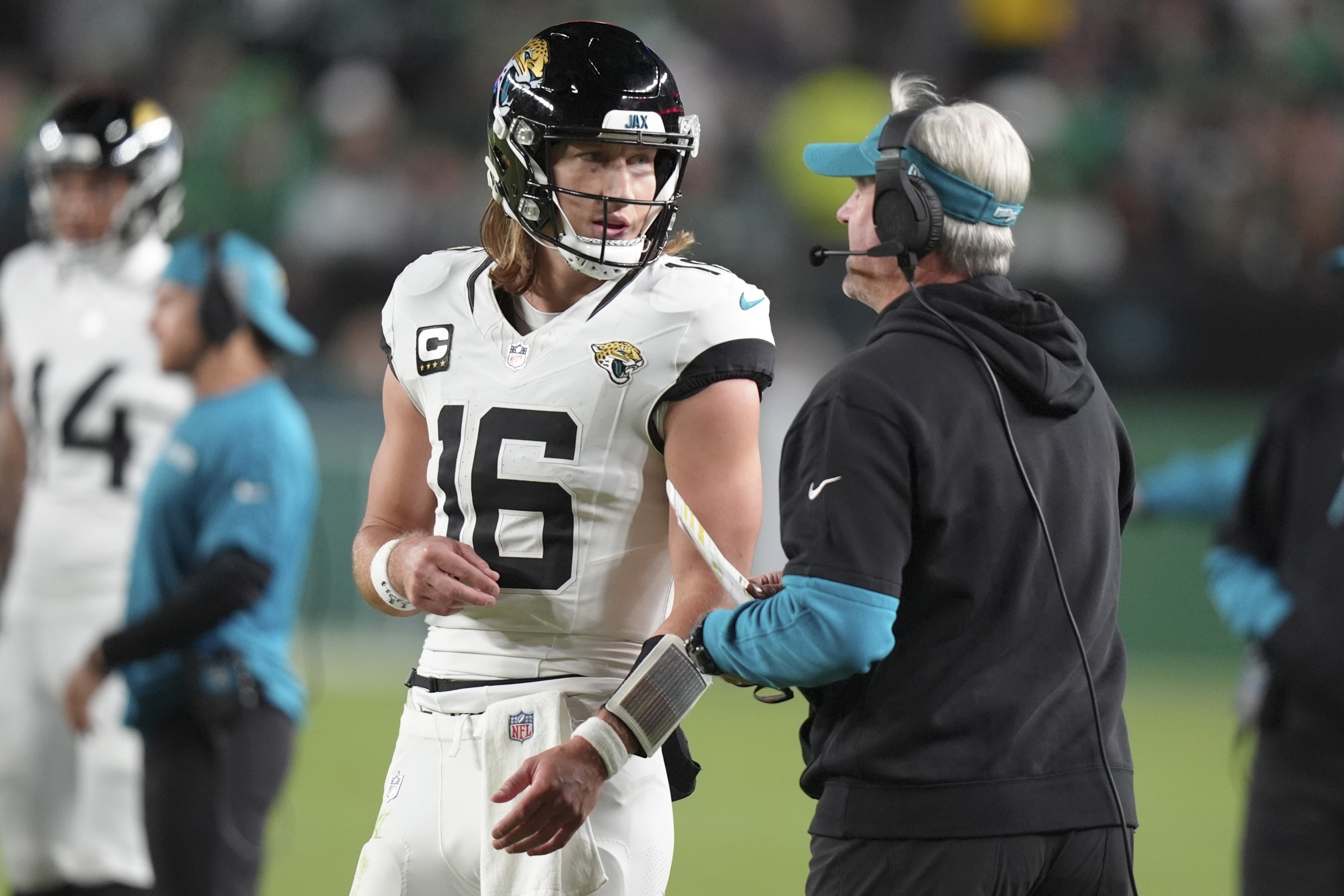 Jacksonville Jaguars quarterback Trevor Lawrence (16) talks to Jaguars head coach Doug Pederson during the second half of an NFL football game against the Philadelphia Eagles on Sunday, Nov. 3, 2024, in Philadelphia.