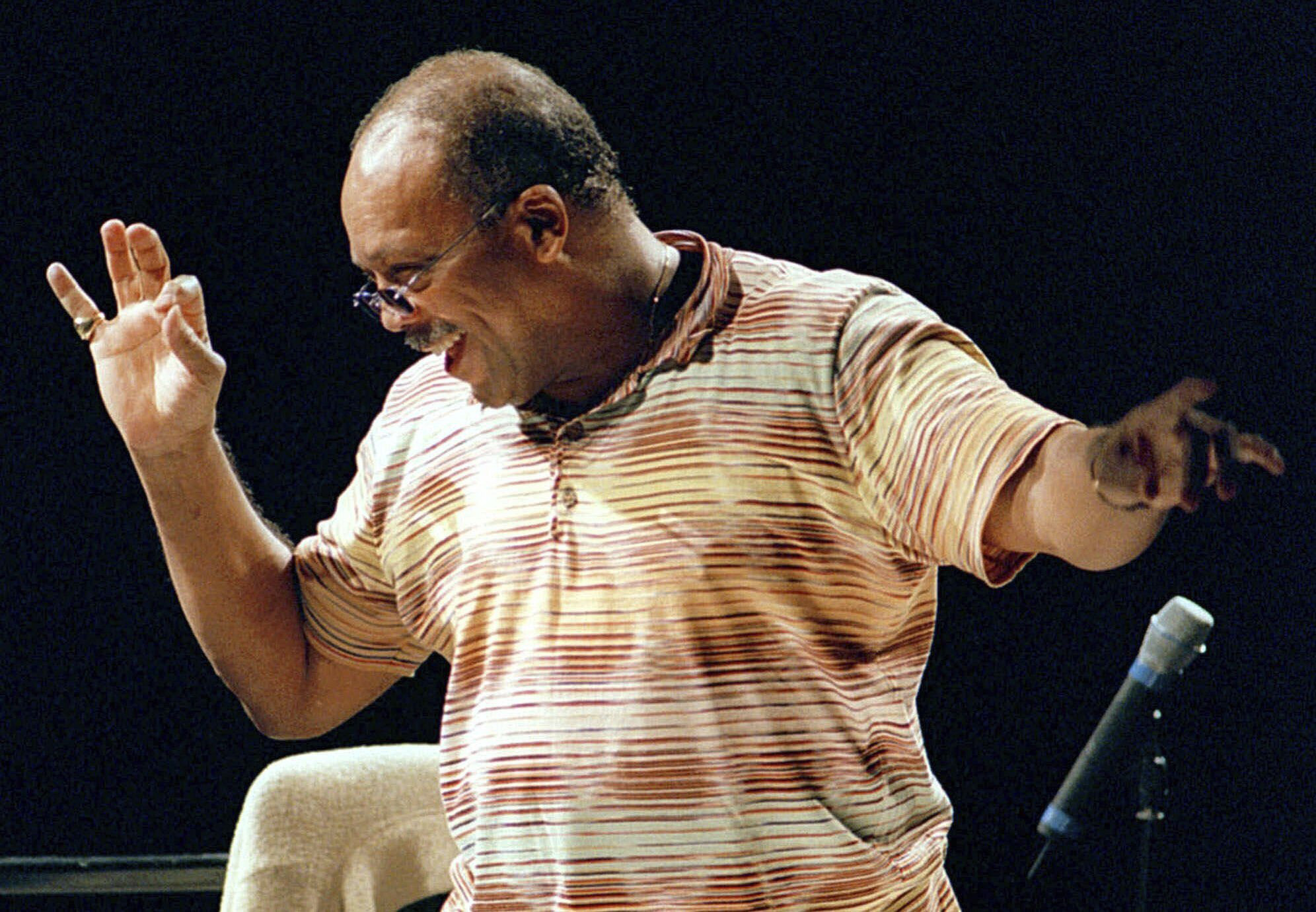 Musician Quincy Jones directs the Orchestra National de France, July 4, 2000, in Paris, during rehearsals prior to the evening's unique concert. Quincy Jones died at age 91.