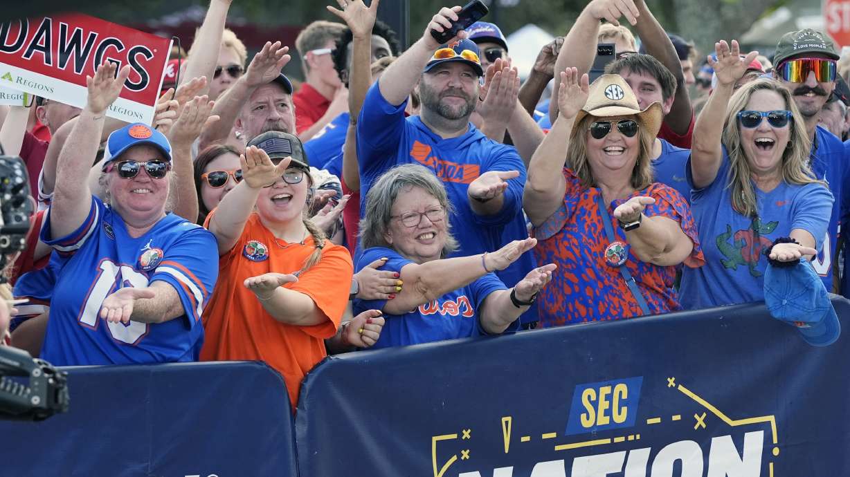 Florida fans cheer outside the stadium before an NCAA college football game between Florida and Georgia, Saturday, Nov. 2, 2024, in Jacksonville, Fla.