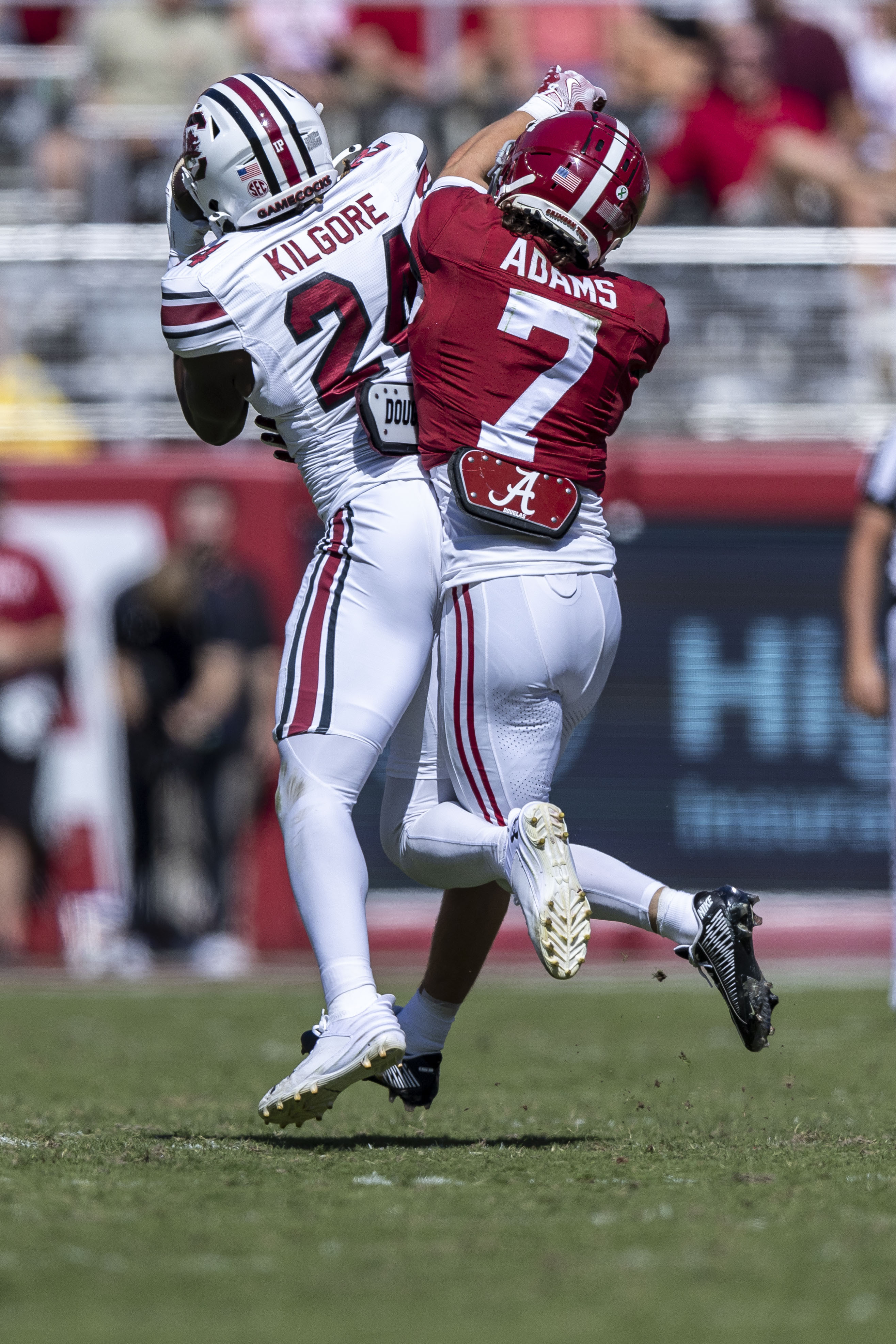 South Carolina defensive back Jalon Kilgore (24) intercepts a pass in front of Alabama wide receiver Cole Adams (7) during the first half of an NCAA college football game, Saturday, Oct. 12, 2024, in Tuscaloosa, Ala.