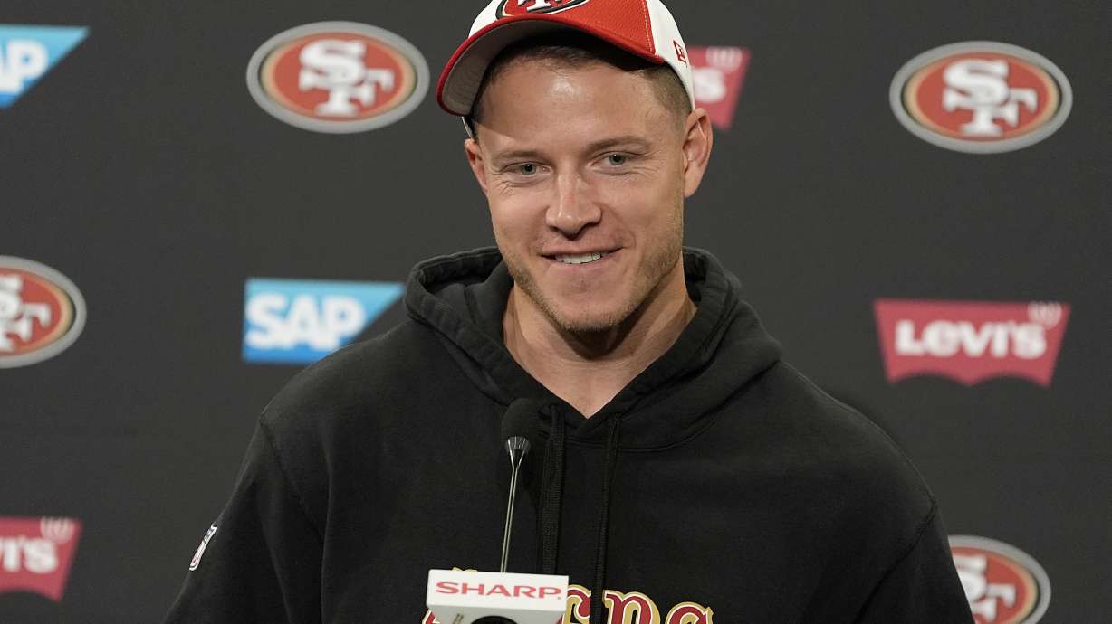 FILE - San Francisco 49ers running back Christian McCaffrey speaks with the media after NFL football practice in Santa Clara, Calif., Tuesday, June 4, 2024.