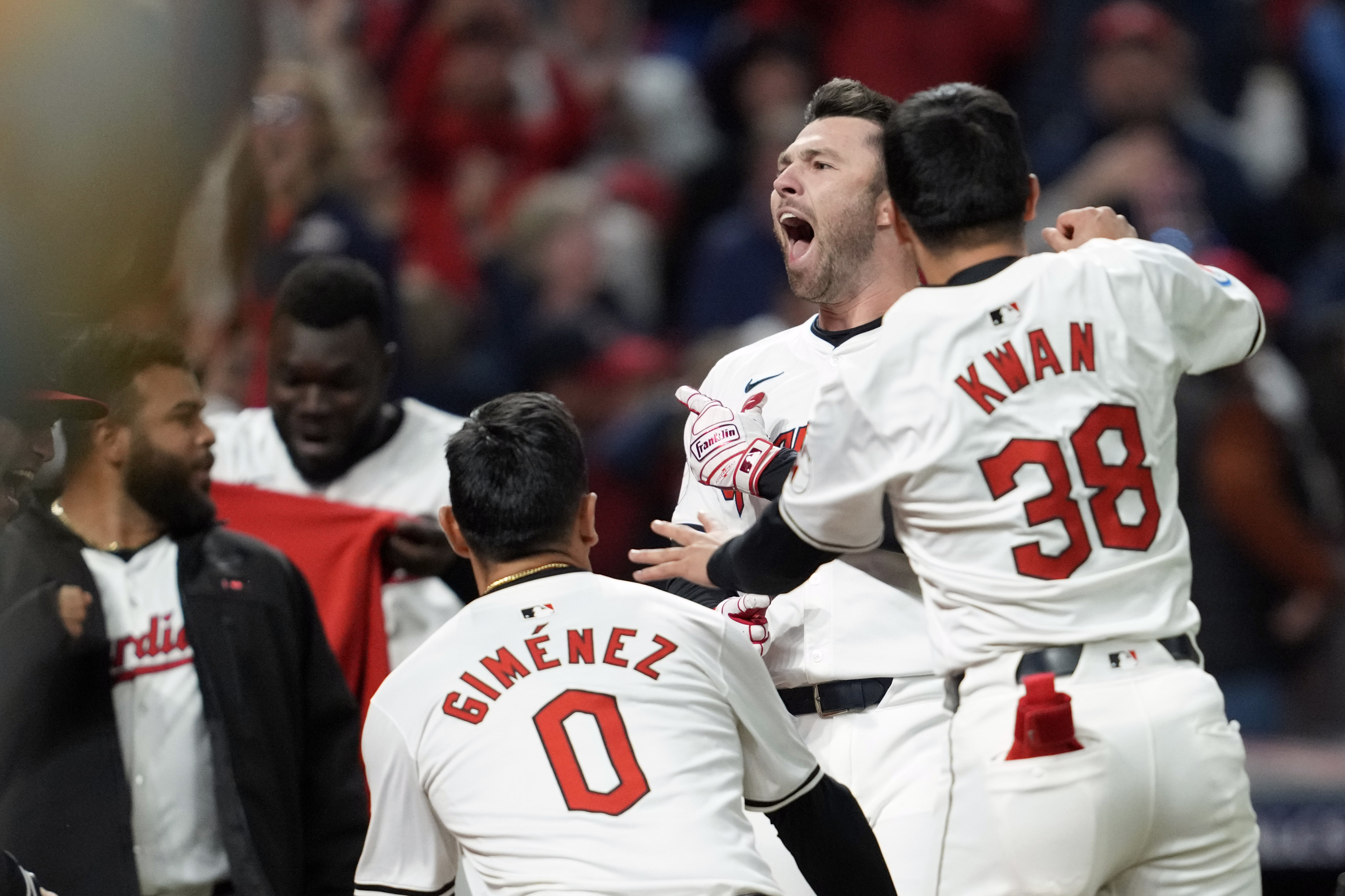 Cleveland Guardians' David Fry, second from right, celebrates with teammates after hitting a game-winning two-run home run against the New York Yankees during the 10th inning in Game 3 of the baseball AL Championship Series Thursday, Oct. 17, 2024, in Cleveland. The Guardians won 7-5.