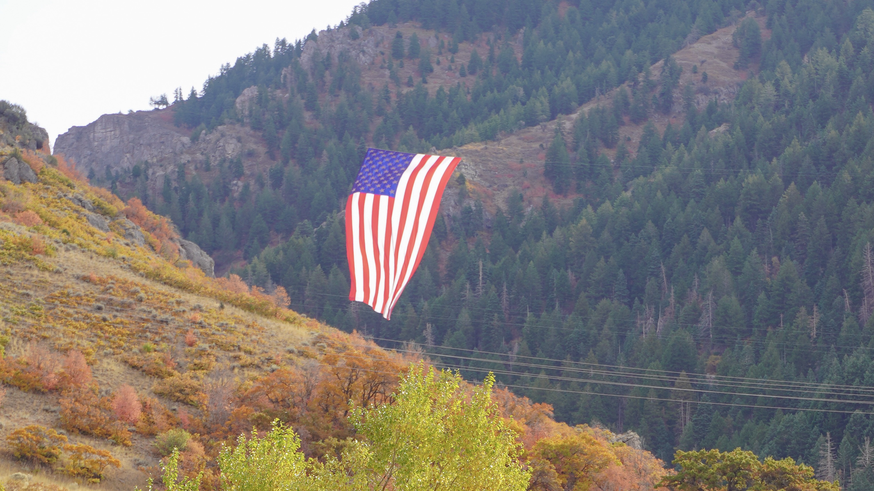 "The Major," a large U.S. flag honoring the late Maj. Brent Taylor, flies in Coldwater Canyon near North Ogden on Saturday. Taylor was killed on Nov 3, 2018, while deployed in Afghanistan.