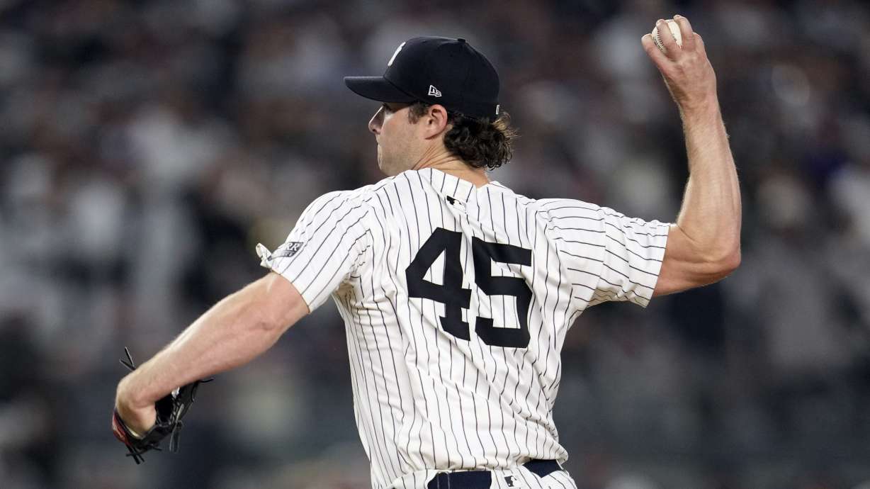 New York Yankees starting pitcher Gerrit Cole throws against the Los Angeles Dodgers during the first inning in Game 5 of the baseball World Series, Wednesday, Oct. 30, 2024, in New York.