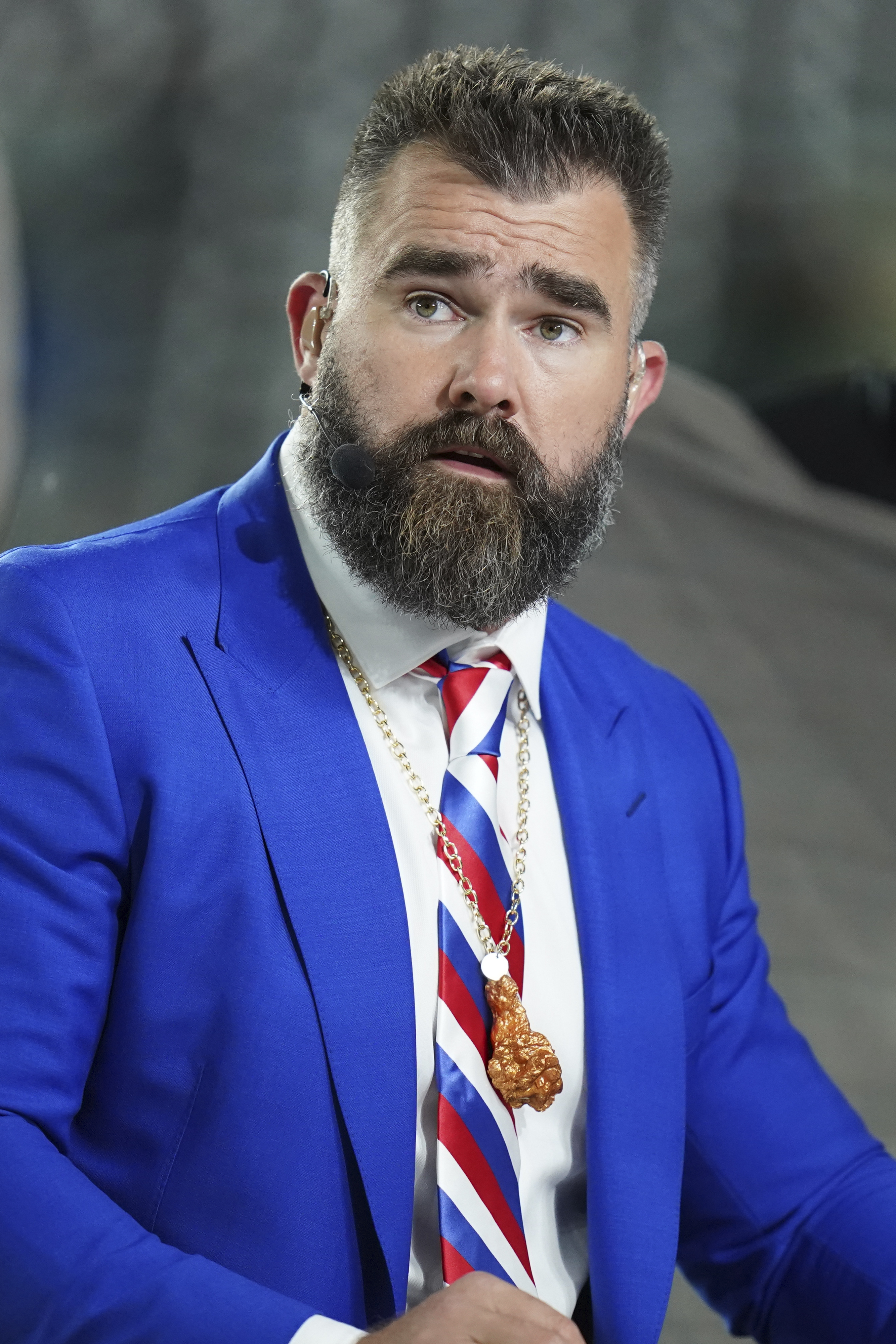 FILE - Former Philadelphia Eagles center Jason Kelce prepares for his ESPN debut as a Monday Night Football Analyst before an NFL football game between the Buffalo Bill and the New York Jets, Oct. 14, 2024 in East Rutherford, N.J.