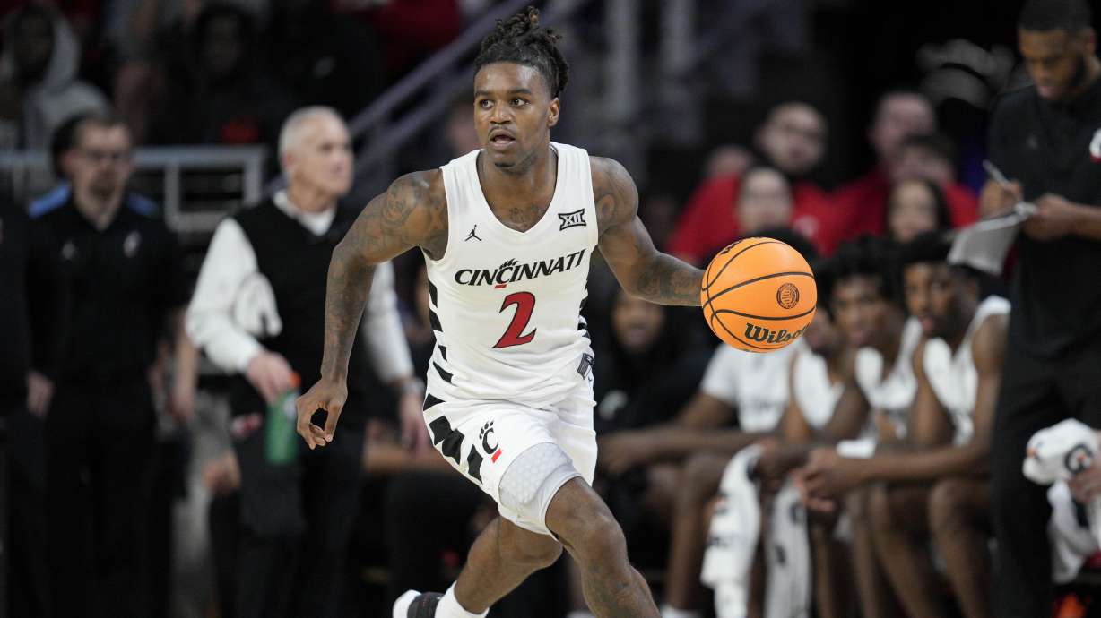 Cincinnati guard Jizzle James (2) dribbles during the first half of an NCAA college basketball game against Arkansas-Pine Bluff, Monday, Nov. 4, 2024, in Cincinnati.