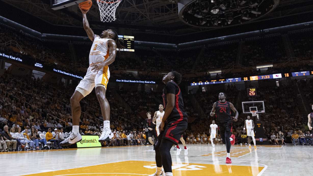 Tennessee guard Chaz Lanier (2) shoots past Gardner Webb guard Darryl Simmons II (8)02 during the first half of an NCAA college basketball game Monday, Nov. 4, 2024, in Knoxville, Tenn.