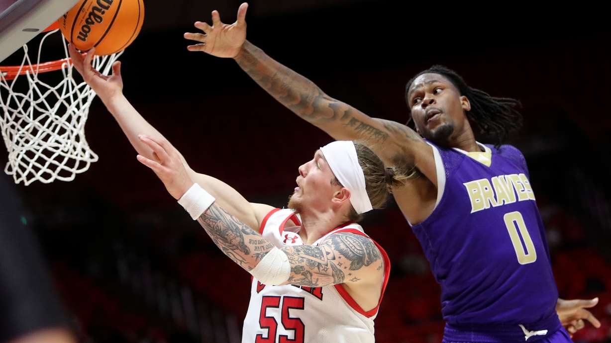 Utah Utes guard Gabe Madsen (55) shoots in front of Alcorn State Braves forward Josh Mitchell (0) during a basketball game at the Huntsman Center in Salt Lake City on Monday, Nov. 4, 2024.
