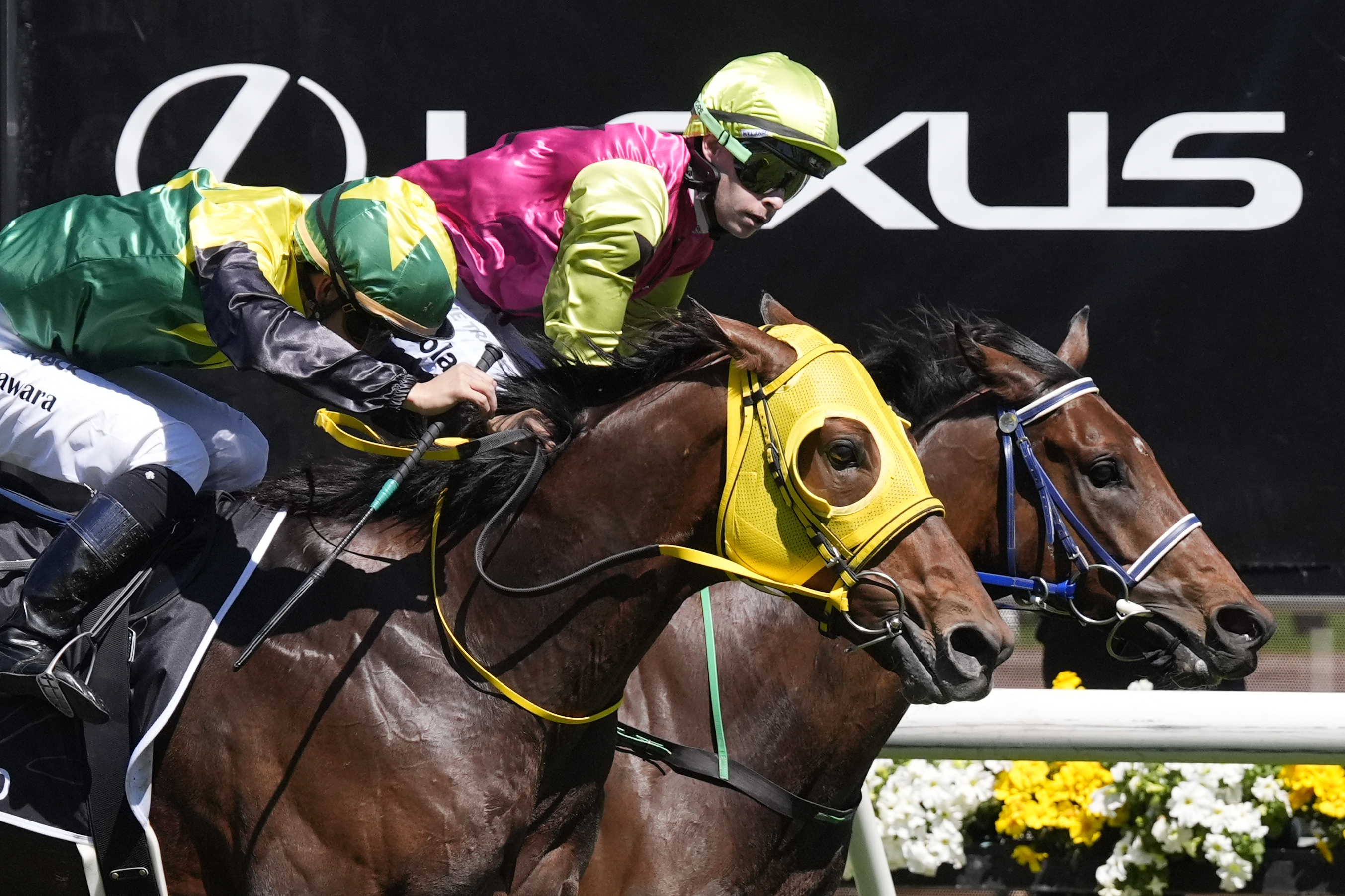 Knight's Choice, right, ridden by Robbie Dolan, crosses the finish line to win the Melbourne Cup horse race ahead of Warp Speed, ridden by Akira Sugawara, at Flemington Racecourse in Melbourne, Australia, Tuesday, Nov. 5, 2024.