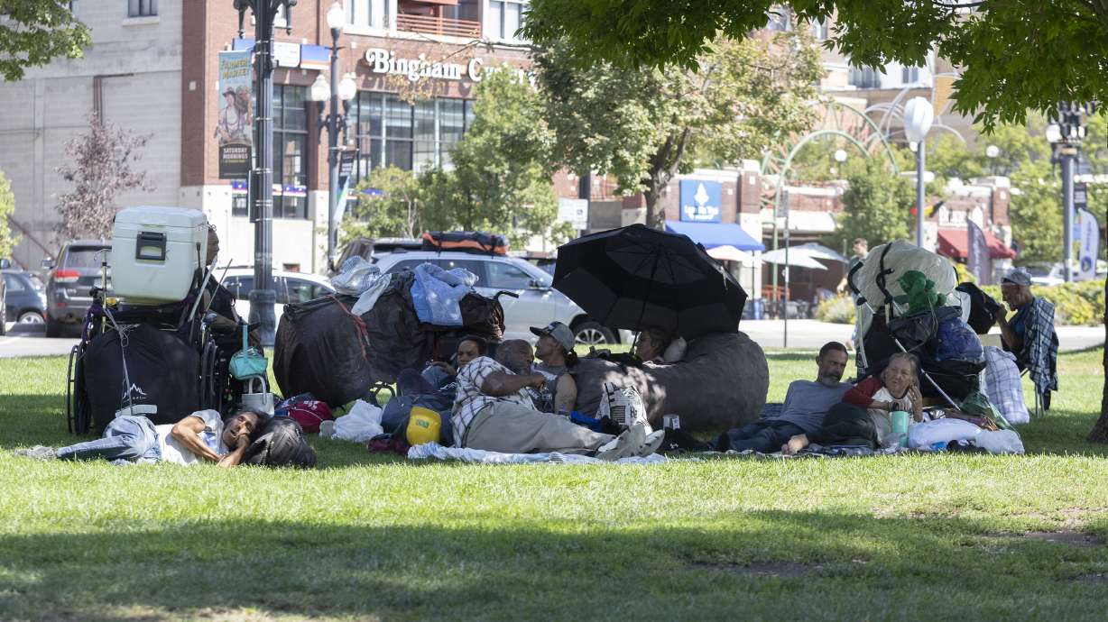 People who are homeless rest at a makeshift day camp in Pioneer Park in Salt Lake City on Sept. 9. The Utah Office of Homeless Services has several contenders for the state's largest shelter and homeless campus along the Wasatch Front.