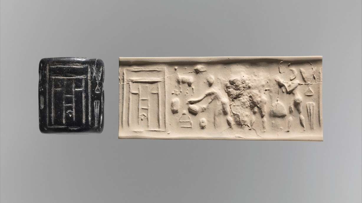 A carved cylinder seal, left, made in the ancient city of Uruk between 3500 and 3100 B.C., is seen next to a sample of the motifs left behind by the seal when it's rolled over clay.