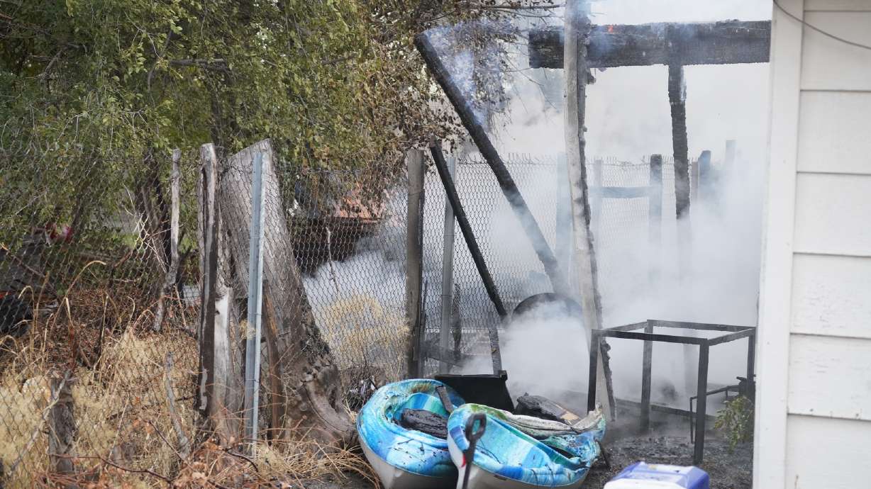 Firefighters respond to a house fire Tuesday in West Valley City.