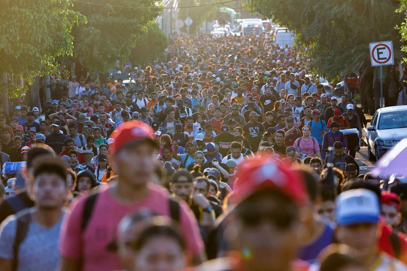 Migrants walk in a caravan during U.S. Presidential Election Day, in an attempt to reach Mexico's northern border, in Tapachula, Mexico, on Tuesday.