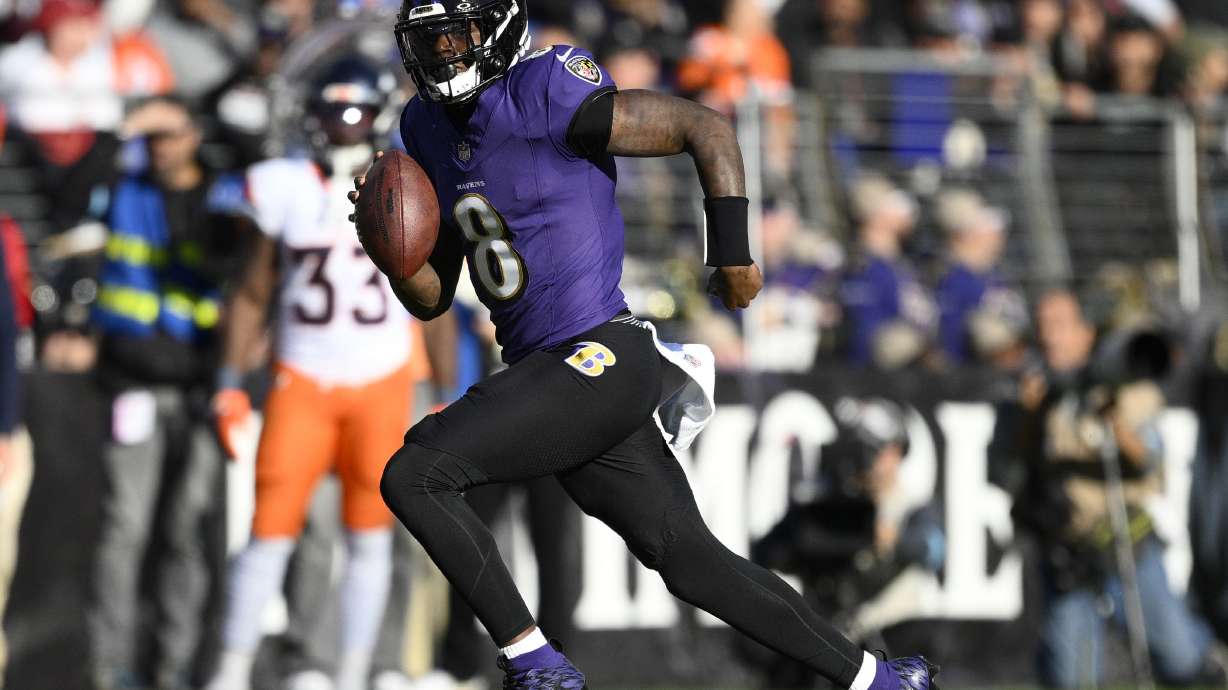 Baltimore Ravens quarterback Lamar Jackson runs with the ball in the second half of an NFL football game against the Denver Broncos in an NFL football game Sunday, Nov. 3, 2024, in Baltimore.