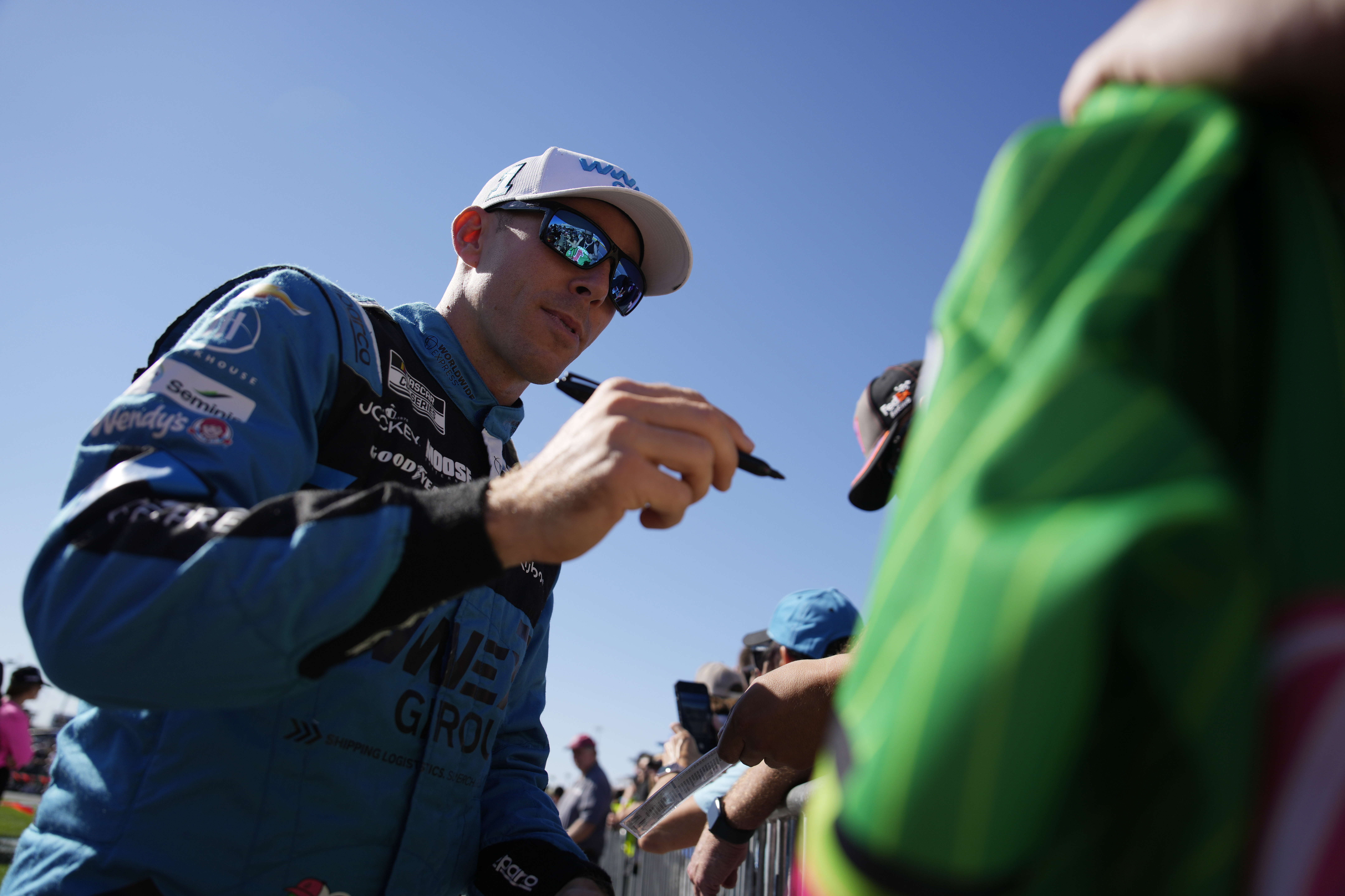NASCAR Cup Series driver Ross Chastain signs autographs before a NASCAR Cup Series auto race Sunday, Oct. 20, 2024, in Las Vegas.