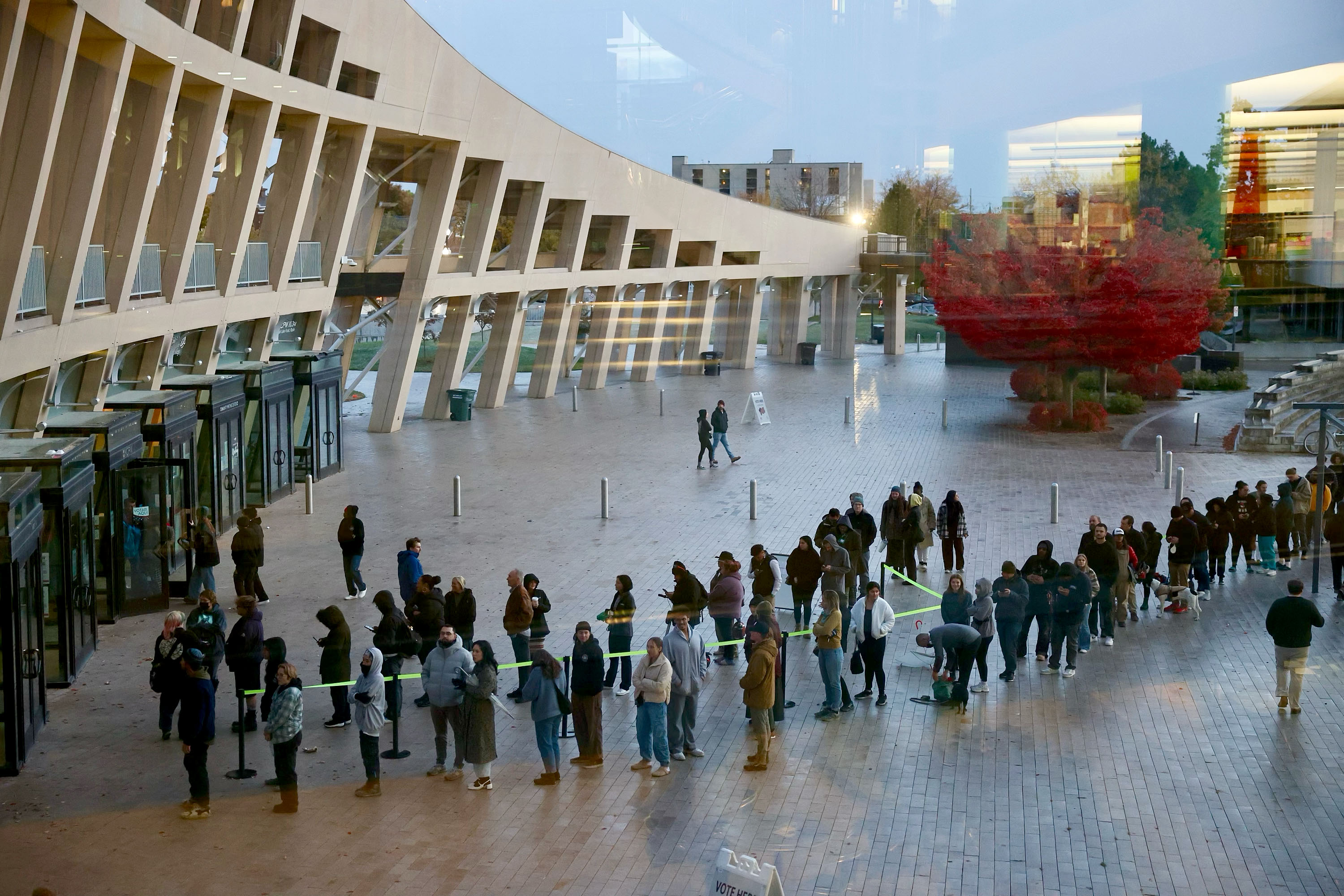 Residents line up outside of the Salt Lake City Library to vote Tuesday evening.