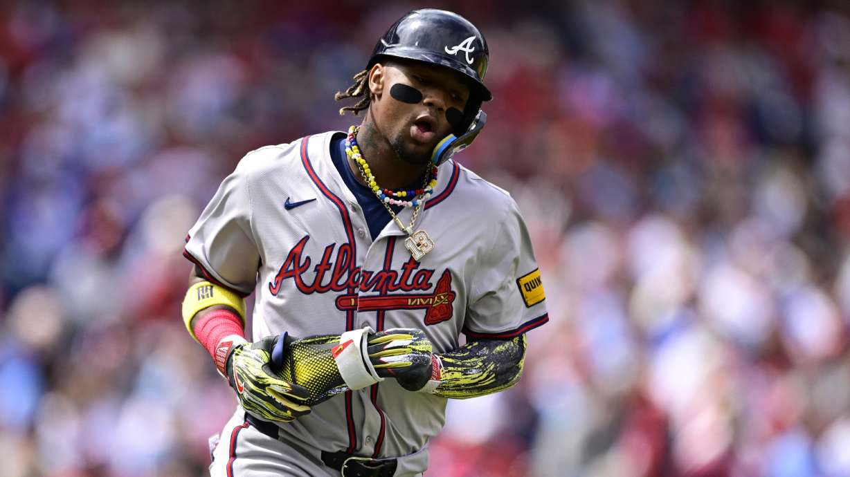 FILE -Atlanta Braves' Ronald Acuna Jr. runs during a baseball game against the Philadelphia Phillies, Sunday, March 31, 2024, in Philadelphia. Braves star outfielder Ronald Acuña Jr. and pitcher Spencer Strider are not expected to recover from injuries in time for Atlanta’s season opener at San Diego on March 27, 2025.