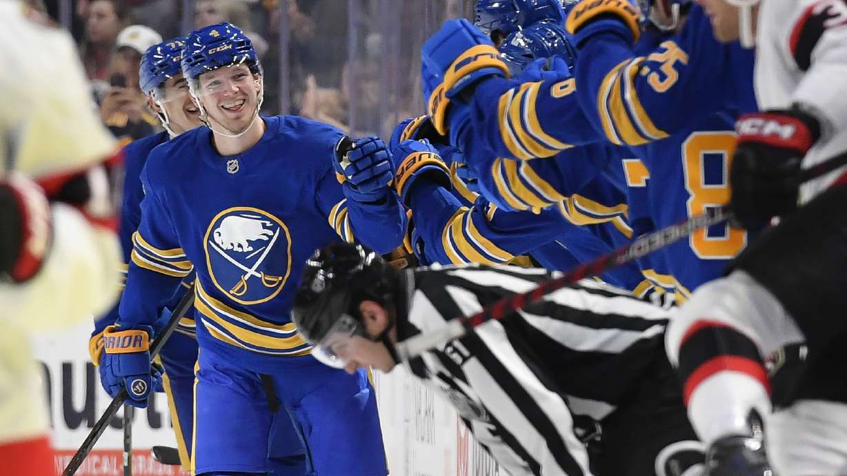 Buffalo Sabres defenseman Bowen Byram, left, celebrates after scoring during the second period of an NHL hockey game against the Ottawa Senators in Buffalo, N.Y., Tuesday, Nov. 5, 2024.