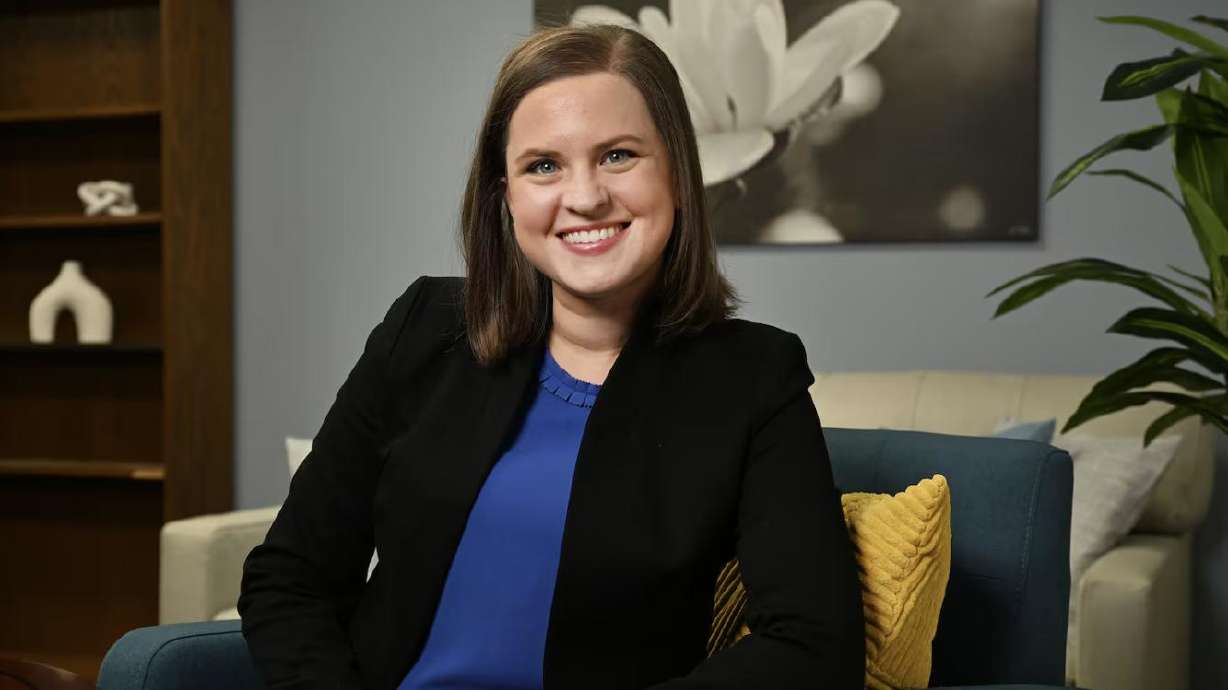 University of Utah assistant psychology professor Samantha Moore-Berg poses for photos in the lab area at the Social & Behavioral Science Building in Salt Lake City on Monday.