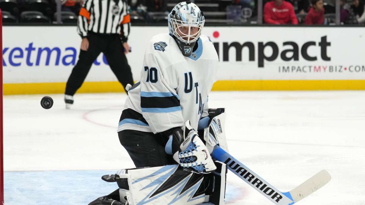 Utah Hockey Club goaltender Karel Vejmelka watches the puck deflect away during the third period of an NHL preseason hockey game against the Anaheim Ducks, Wednesday, Oct. 2, 2024, in Anaheim, Calif.