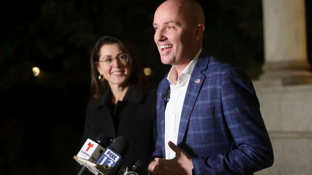 Lt. Gov. Deidre Henderson listens as Gov. Spencer Cox talks to members of the media after the gubernatorial election was called for Cox outside of the Governor’s Mansion in Salt Lake City on Tuesday.