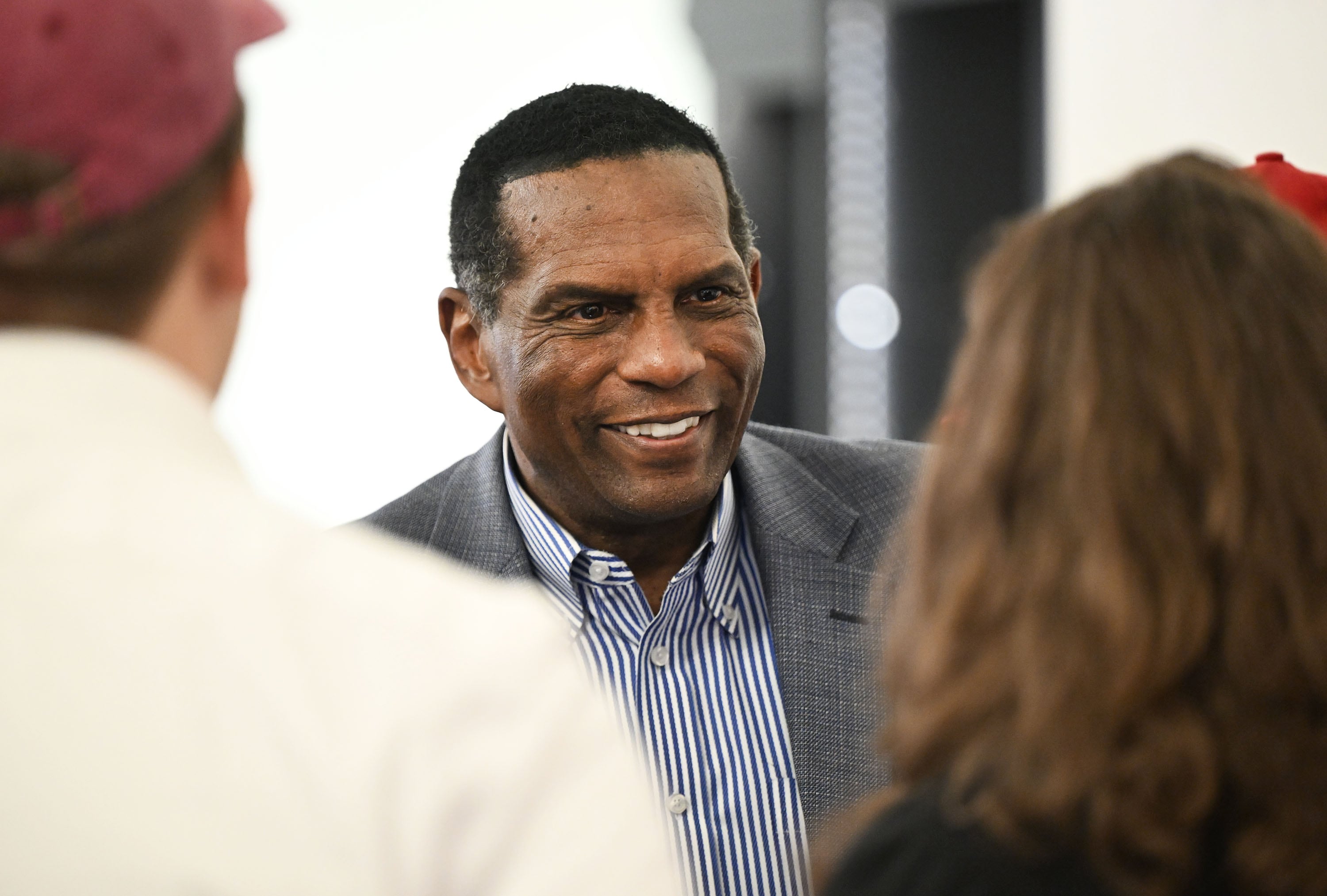 Rep. Burgess Owens, R-Utah, talks with supporters while at the Utah GOP party in Draper on Tuesday.