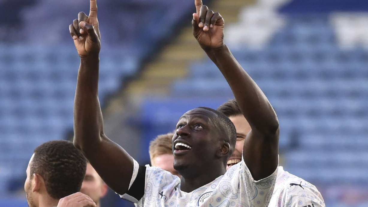 FILE - Manchester City's Benjamin Mendy celebrates after scoring his side's opening goal during the English Premier League soccer match between Leicester City and Manchester City in Leicester, England, Saturday, April 3, 2021.