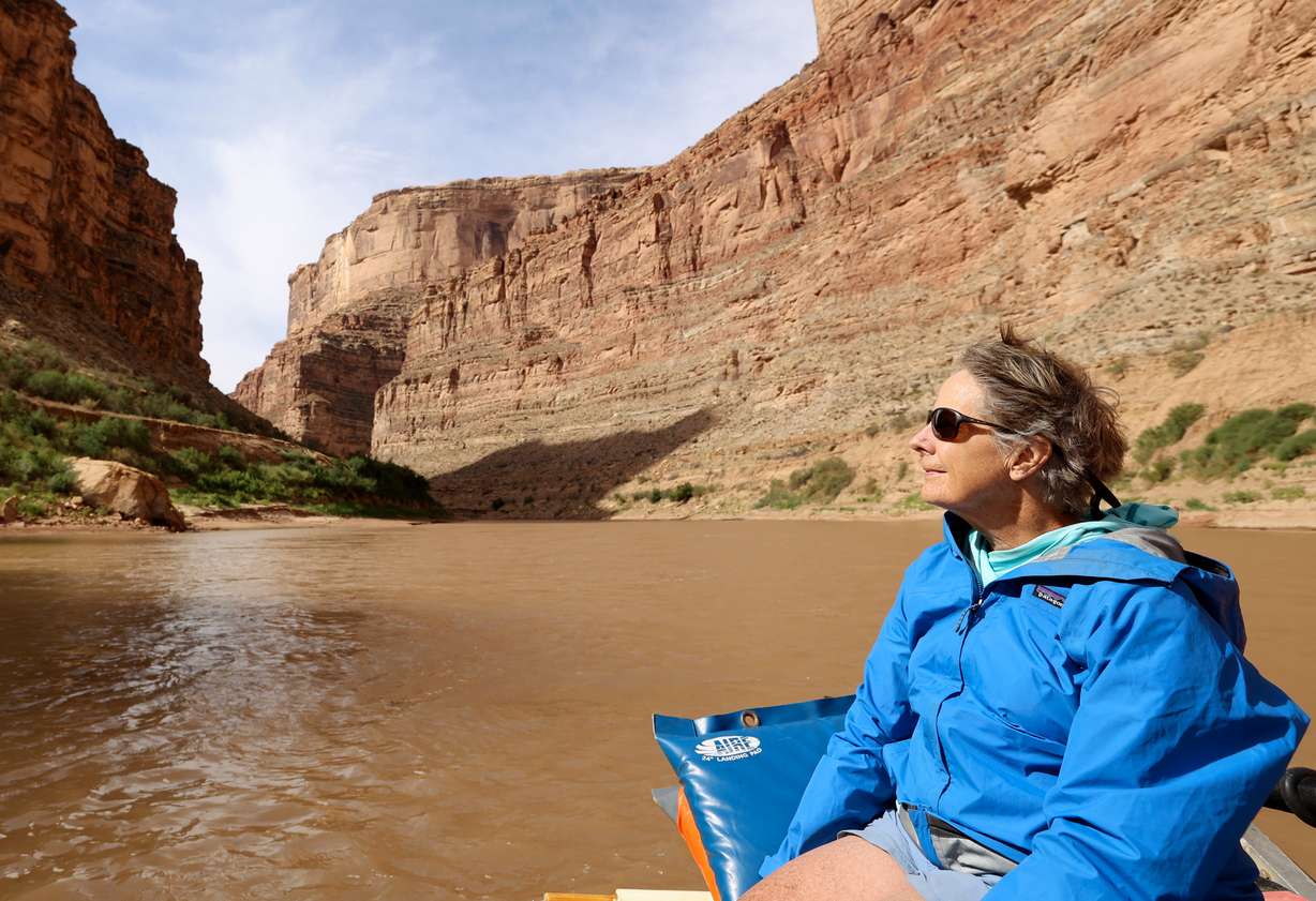Anne Castle, U.S. commissioner for the Upper Colorado River Commission, takes in the scenery on a Returning Rapids trip in Cataract Canyon on the Colorado River on Sept. 21.
