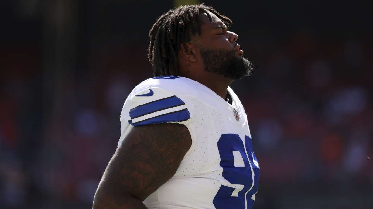 FILE - Dallas Cowboys defensive tackle Jordan Phillips (98) warms up prior to the start of an NFL football game against the Cleveland Browns, Sept. 8, 2024, in Cleveland.