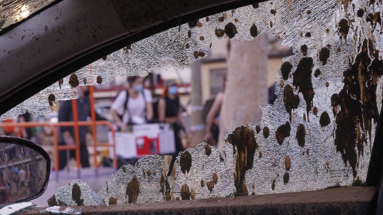A mud splattered broken car window is pictured during the clean up operation after flooding in Massanassa on the outskirts of Valencia, Spain, Wednesday, Nov. 6, 2024.