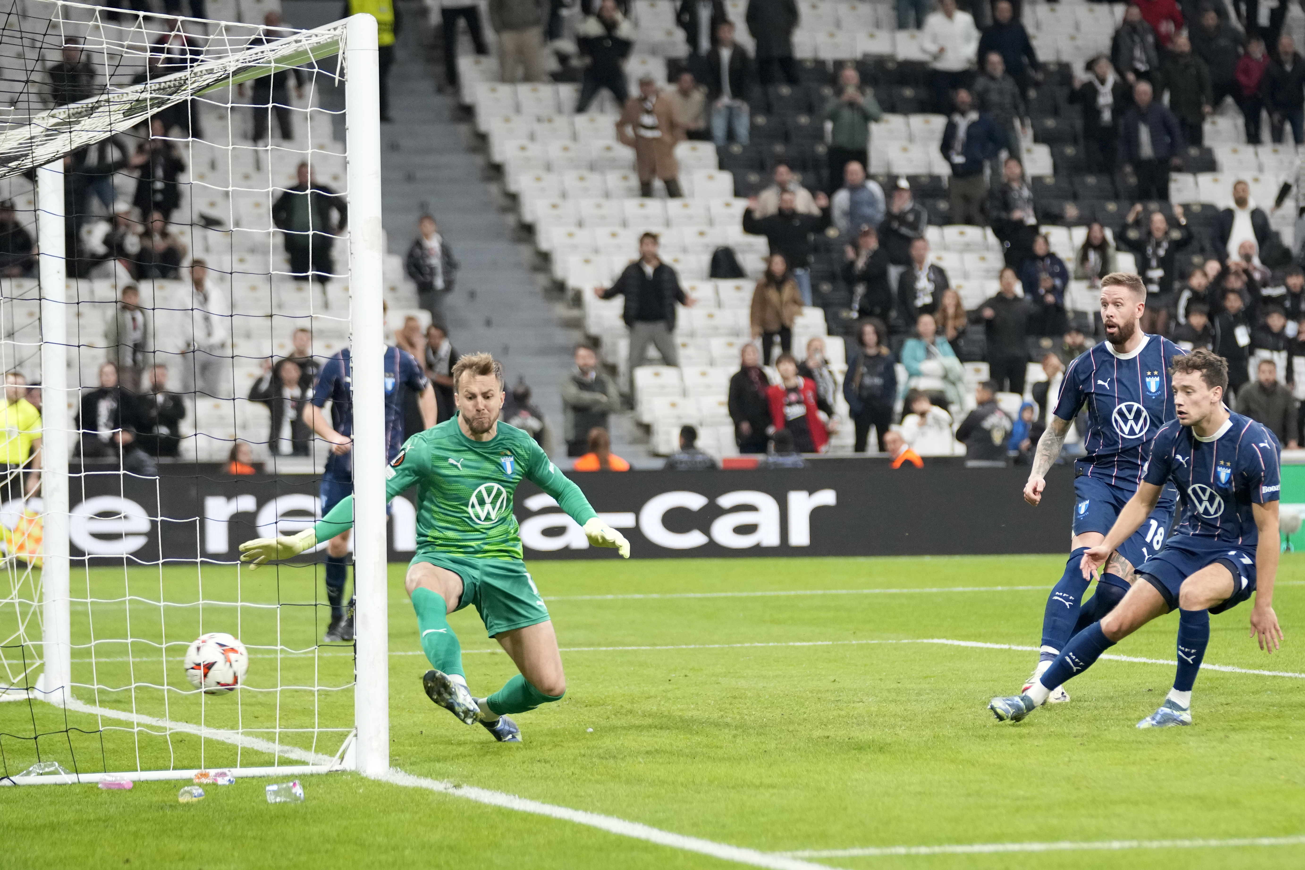 Malmo's goalkeeper Ricardo Friedrich fails to stop a shot by Besiktas' Ernest Muci to open the score during the Europa League opening phase soccer match between Besiktas and Malmo at the Besiktas stadium in Istanbul, Turkey, Wednesday, Nov. 6, 2024.