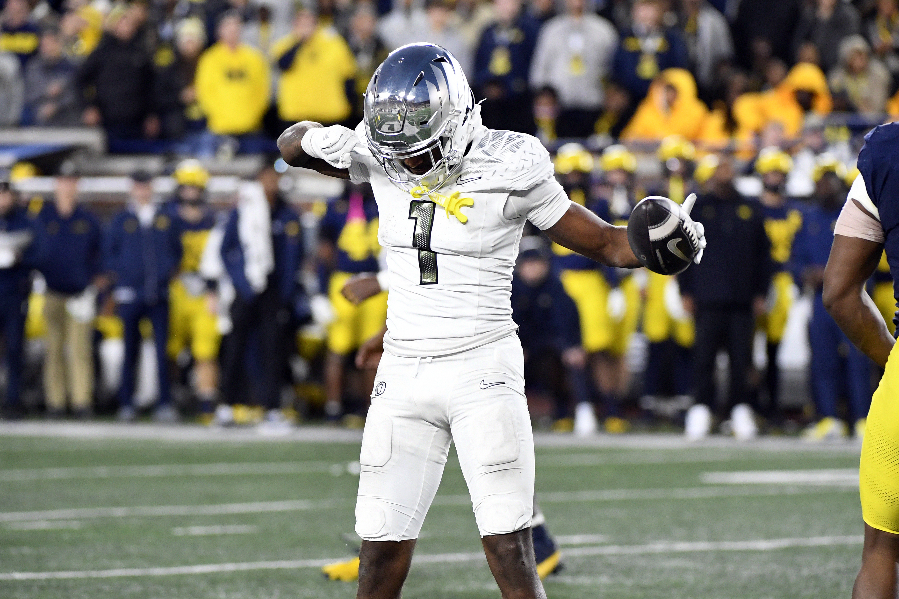 Oregon wide receiver Traeshon Holden reacts after making a catch for a first down against Michigan in the second half of an NCAA college football game, Saturday, Nov. 2, 2024, in Ann Arbor, Mich. Oregon defeated Michigan 38-17.