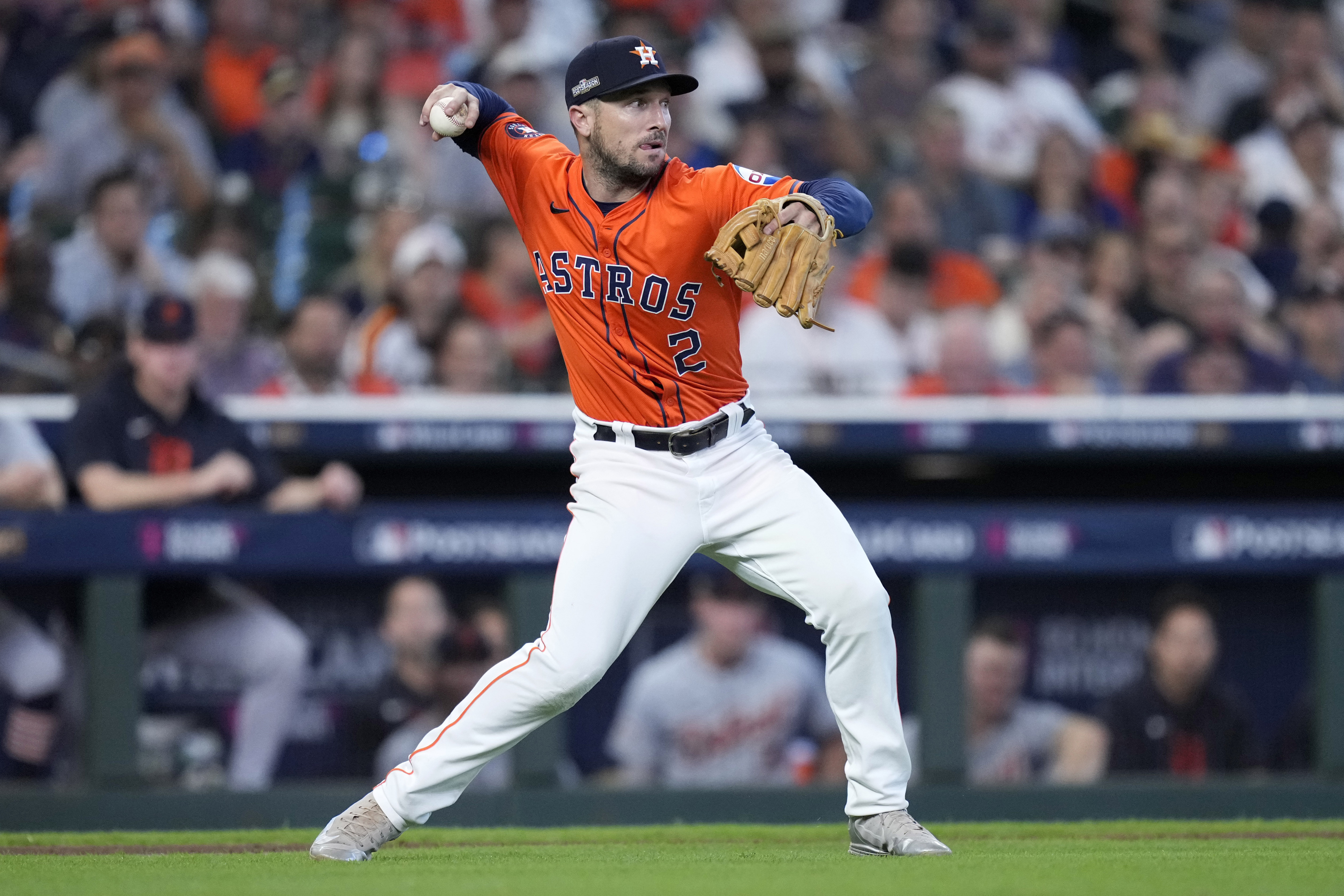 FILE - Houston Astros third baseman Alex Bregman throws to second after fielding a bunt by Detroit Tigers' Parker Meadows in the ninth inning of Game 2 of an AL Wild Card Series baseball game Wednesday, Oct. 2, 2024, in Houston.
