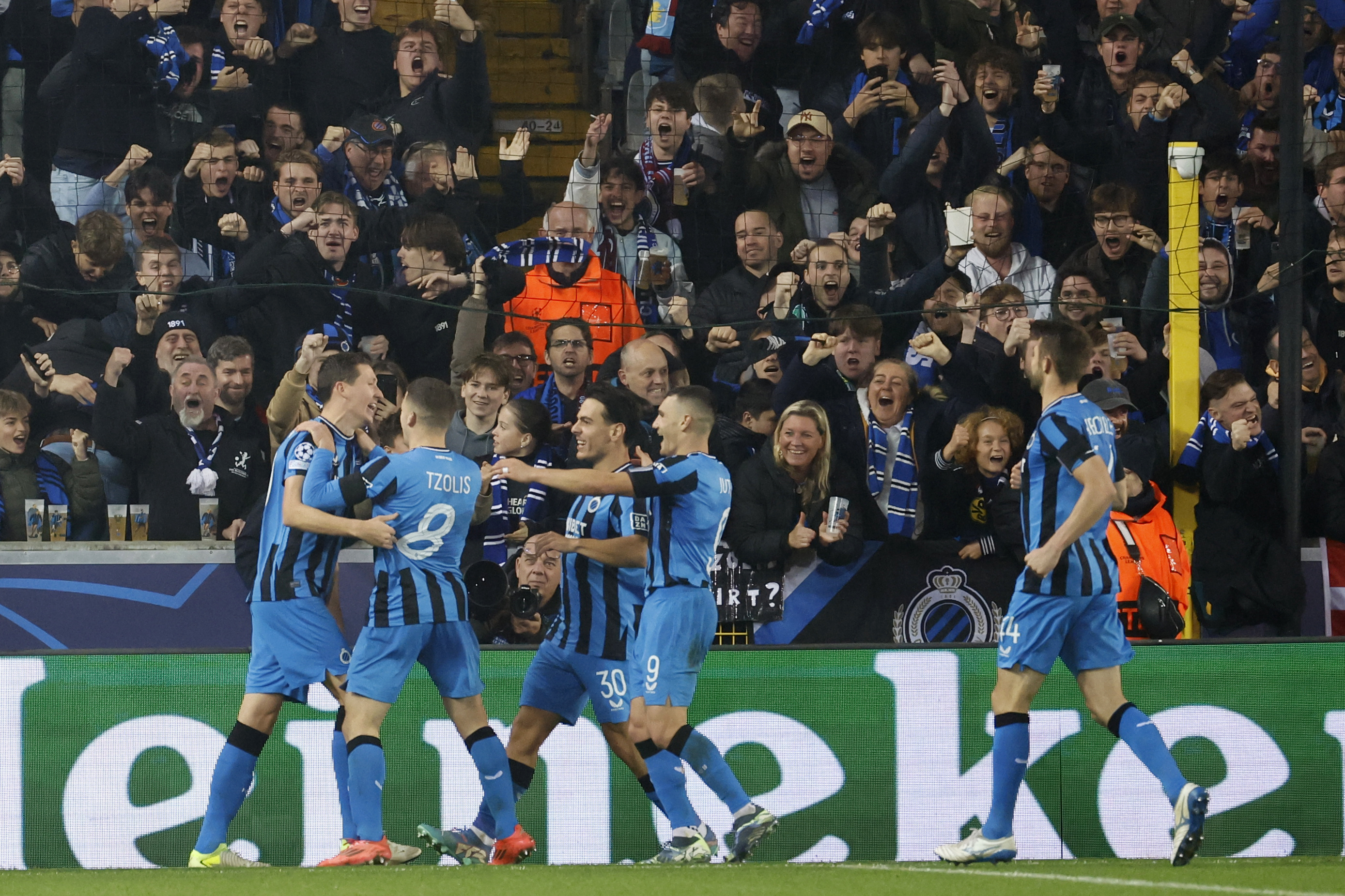 Brugge's Hans Vanaken, left, celebrates with teammates after scoring a penalty his side's first goal, during the Champions League opening phase soccer match between Club Brugge and Aston Villa at Jan Breydelstadion in Bruges, Belgium, Wednesday, Nov. 6, 2024.