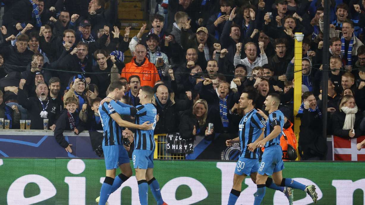 Brugge's Hans Vanaken, left, celebrates with teammates after scoring a penalty his side's first goal, during the Champions League opening phase soccer match between Club Brugge and Aston Villa at Jan Breydelstadion in Bruges, Belgium, Wednesday, Nov. 6, 2024.