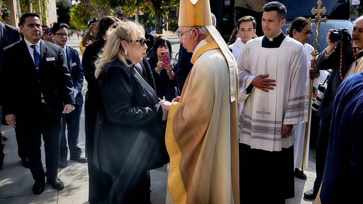 Archbishop José H. Gomez greets Linda Valenzuela after a public funeral Mass for her husband, former Los Angeles Dodger pitcher Fernando Valenzuela, at the Cathedral of Our Lady of the Angels in Los Angeles on Wednesday, Nov. 6, 2024.